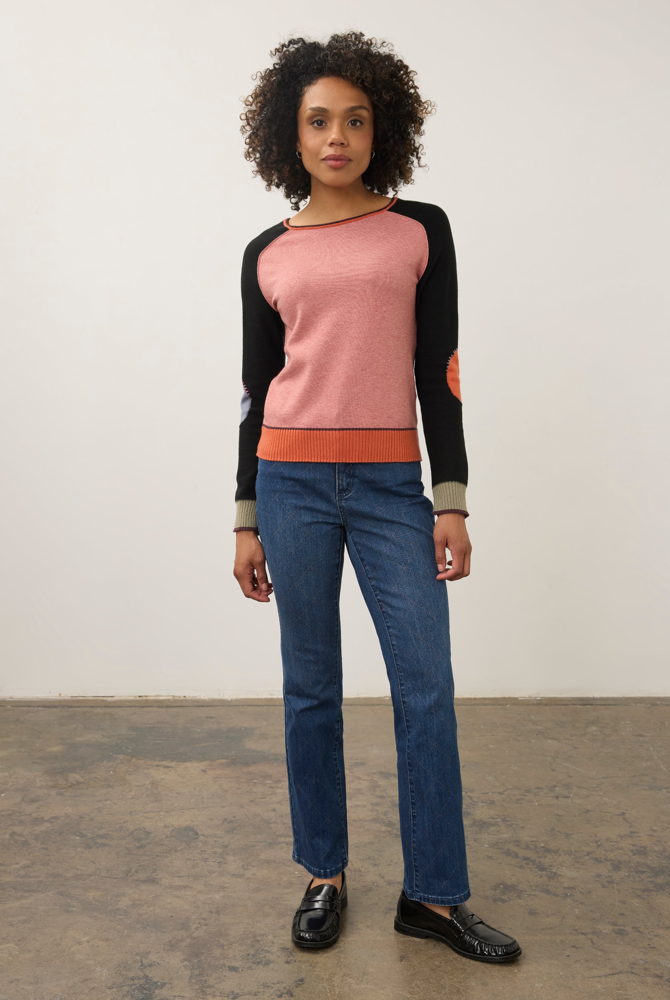 Model in pink and black colorblock sweater with jeans, full outfit view by French Dressing Jeans (FDJ)