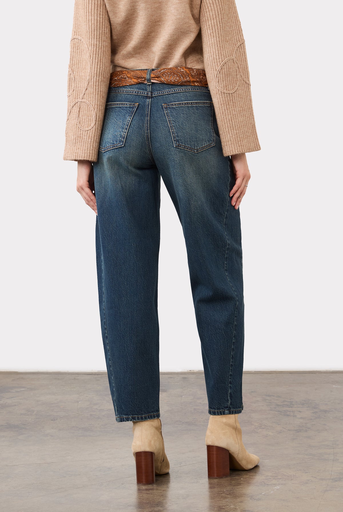 Back view of medium blue jeans highlighting patch pockets and straight leg cut by French Dressing Jeans (FDJ)