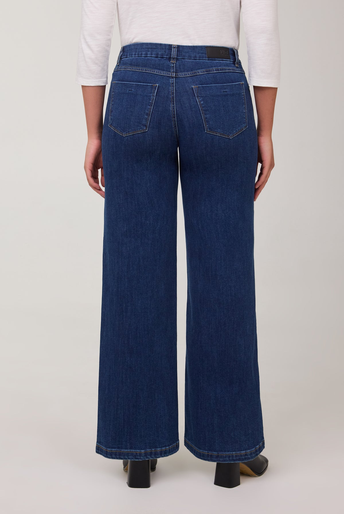 Back view of wide-leg jeans in Delight color with patch pockets by French Dressing Jeans (FDJ)