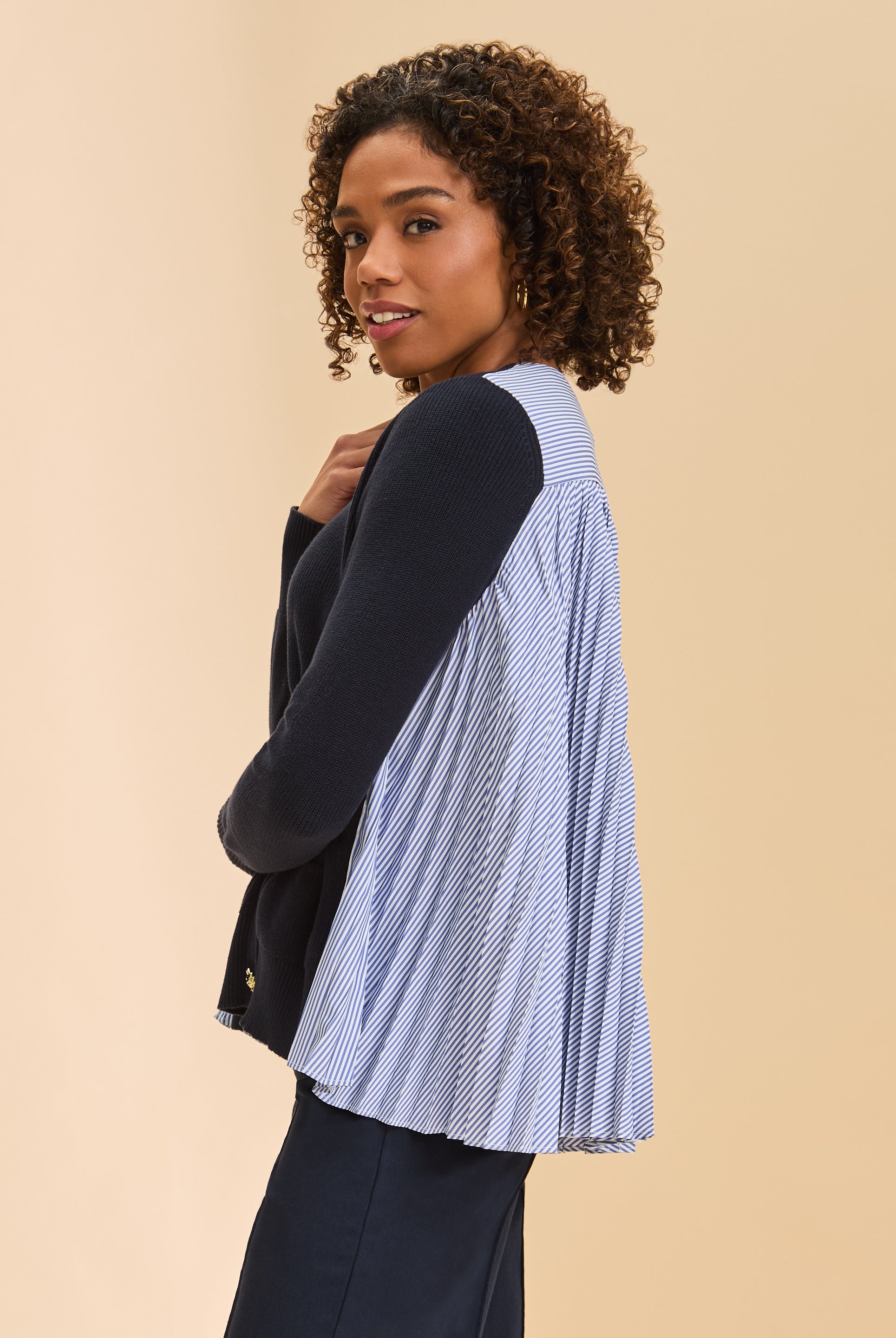 Side view of navy cardigan with striped side panels and ribbed sleeves by French Dressing Jeans (FDJ)