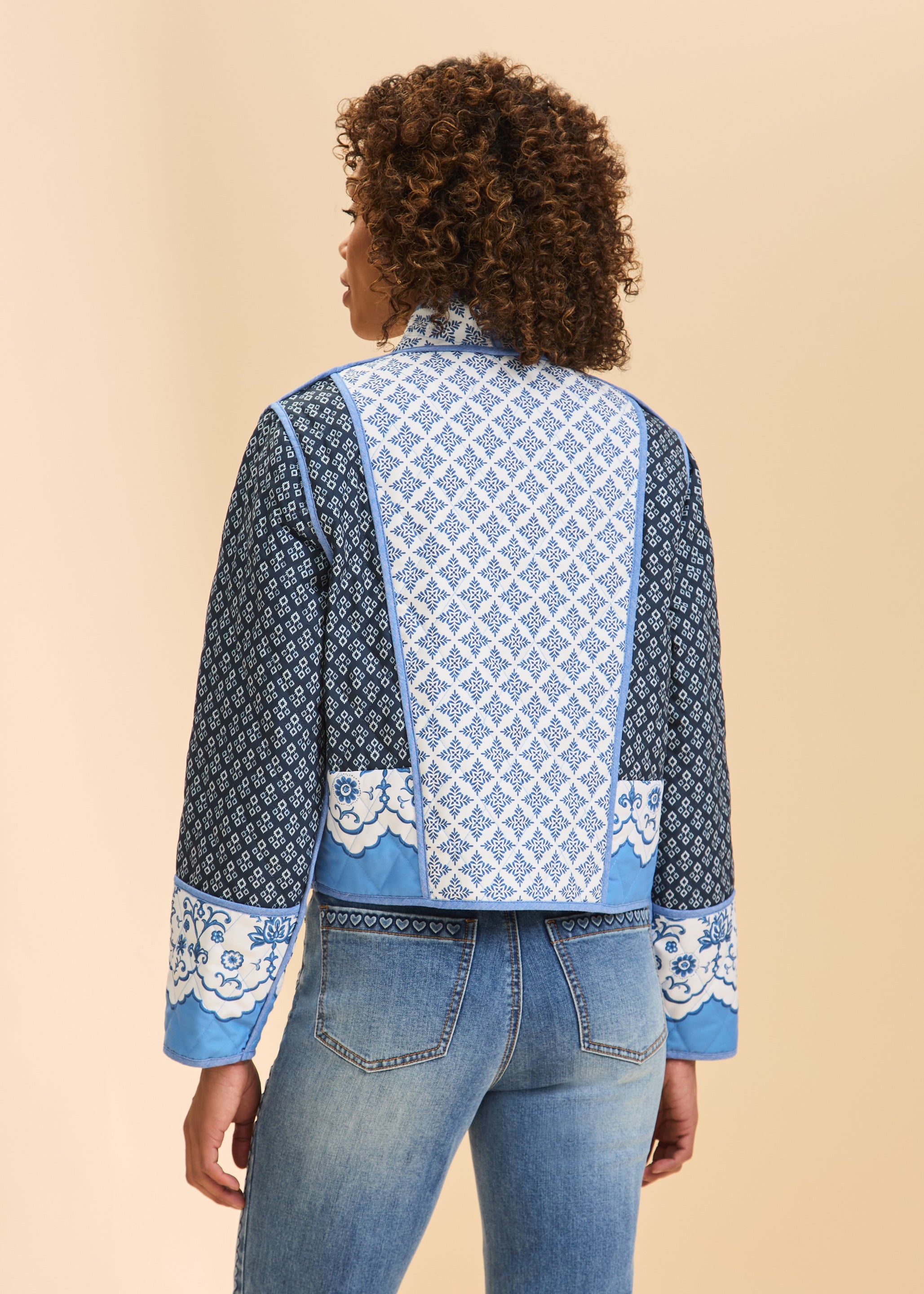Back view of blue quilted jacket featuring geometric patterns and long sleeves by French Dressing Jeans (FDJ)