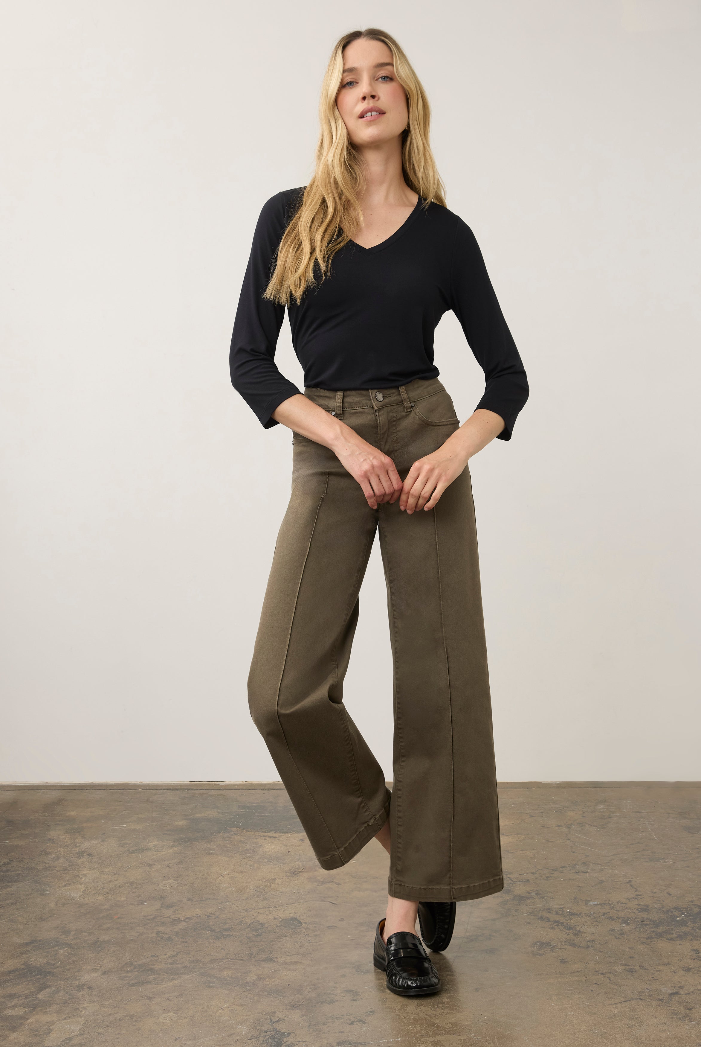 Full body view of black V-neck top paired with wide-leg pants by French Dressing Jeans (FDJ)