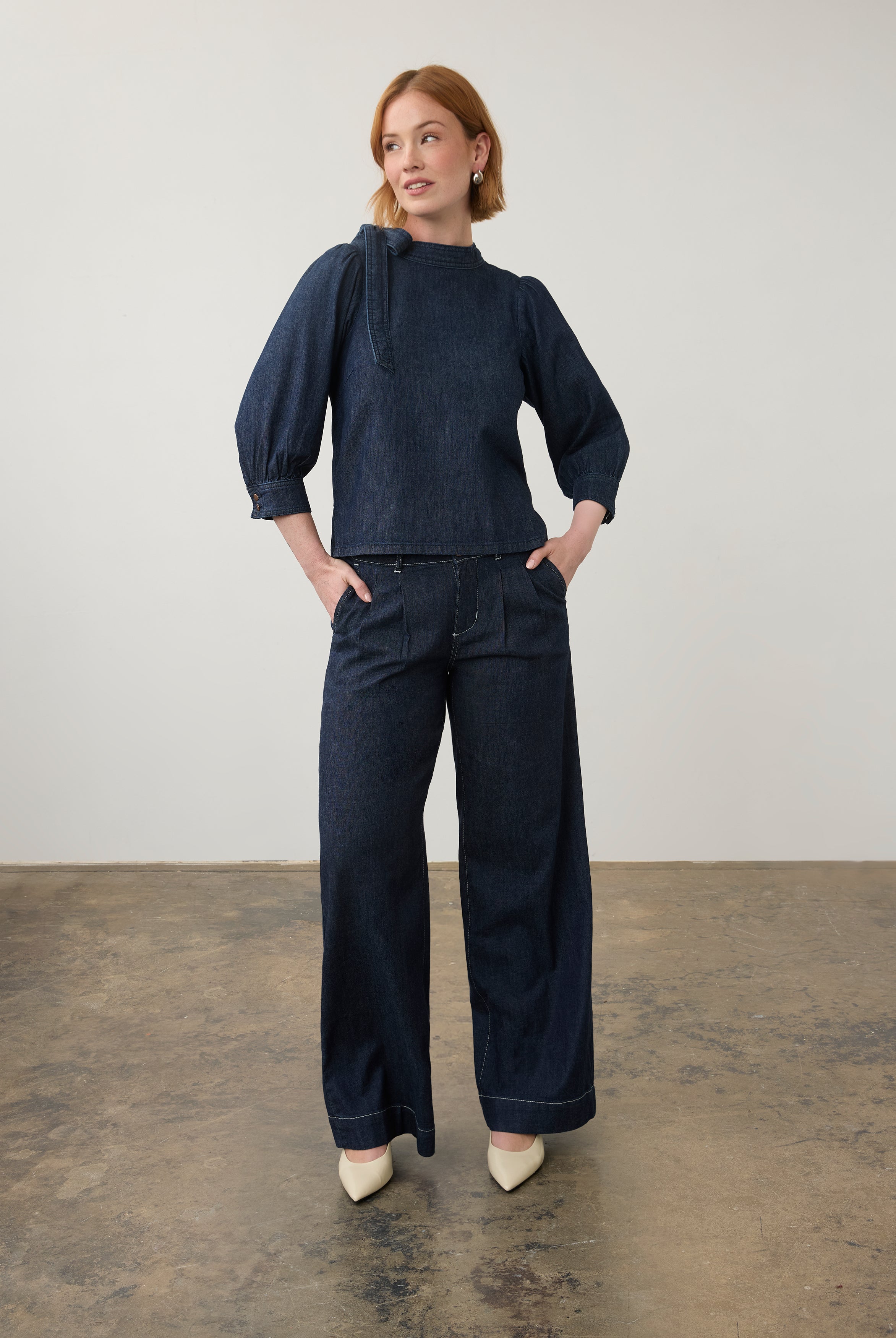 Full view of dark wash denim set with puff-sleeve top and wide-leg pants by French Dressing Jeans (FDJ)