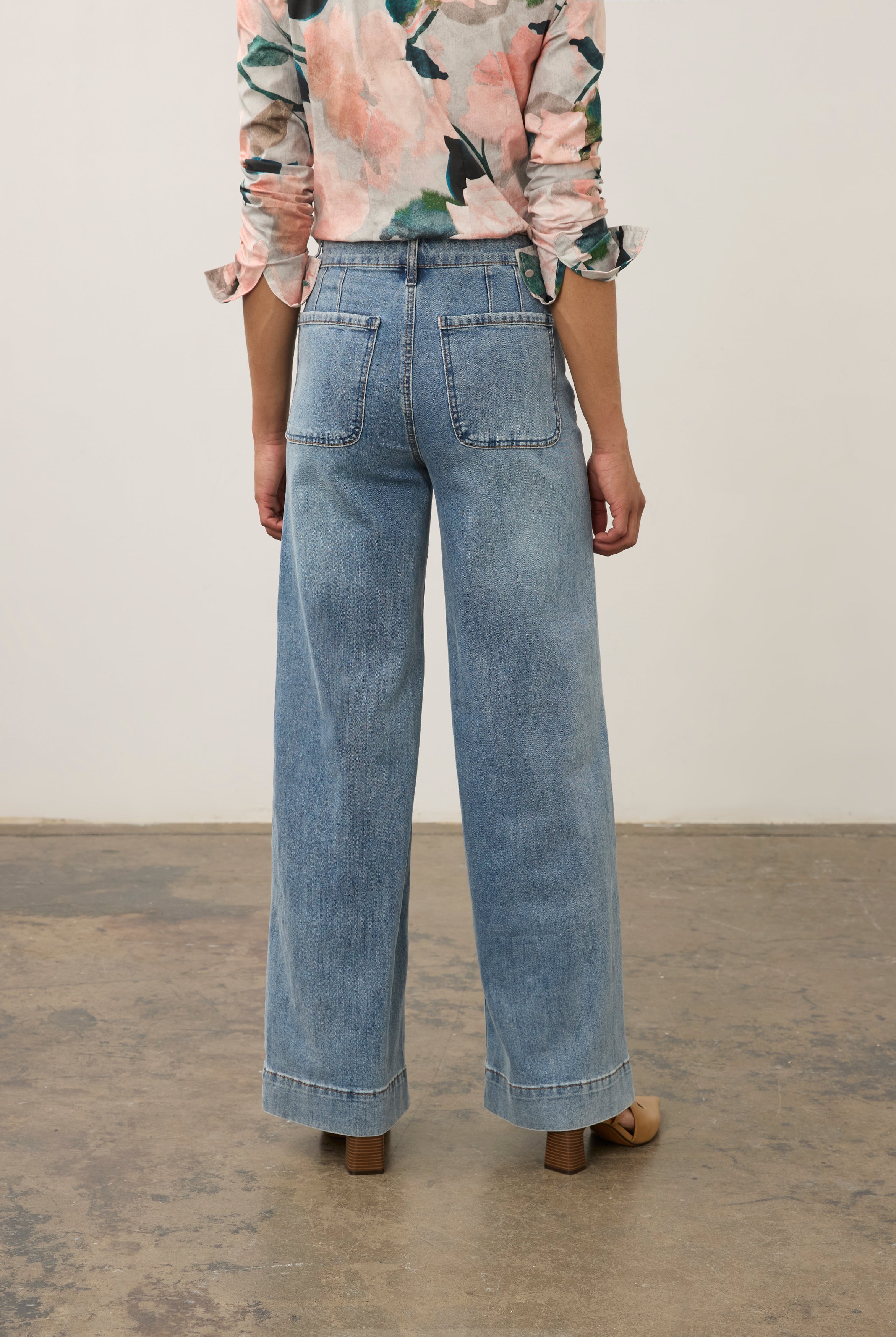 Back view of medium blue Olivia denim highlighting clean patch pockets by French Dressing Jeans (FDJ)