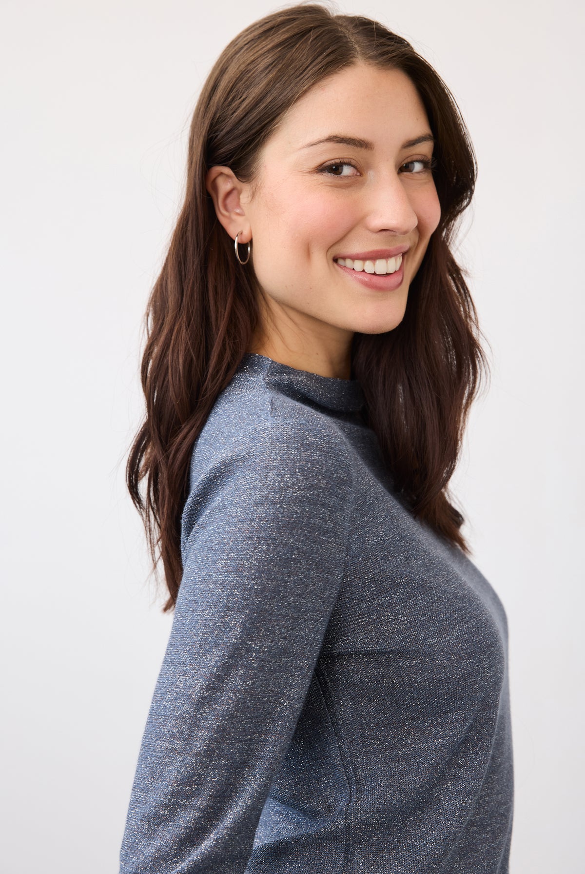 Side view of blue shimmer top highlighting fabric sheen and fit by French Dressing Jeans (FDJ)