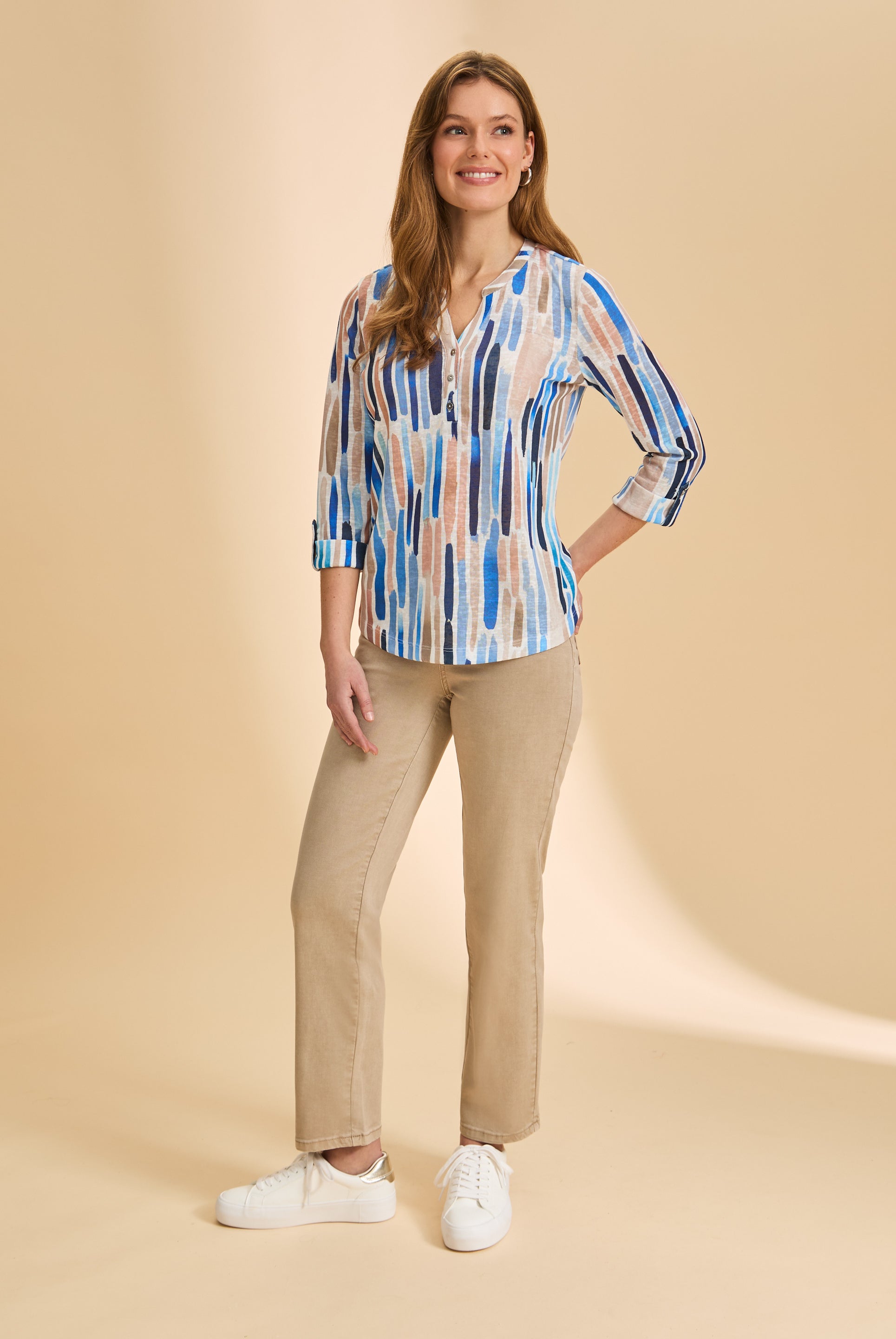 Front view of sand straight-leg jeans, styled with patterned top by French Dressing Jeans (FDJ)