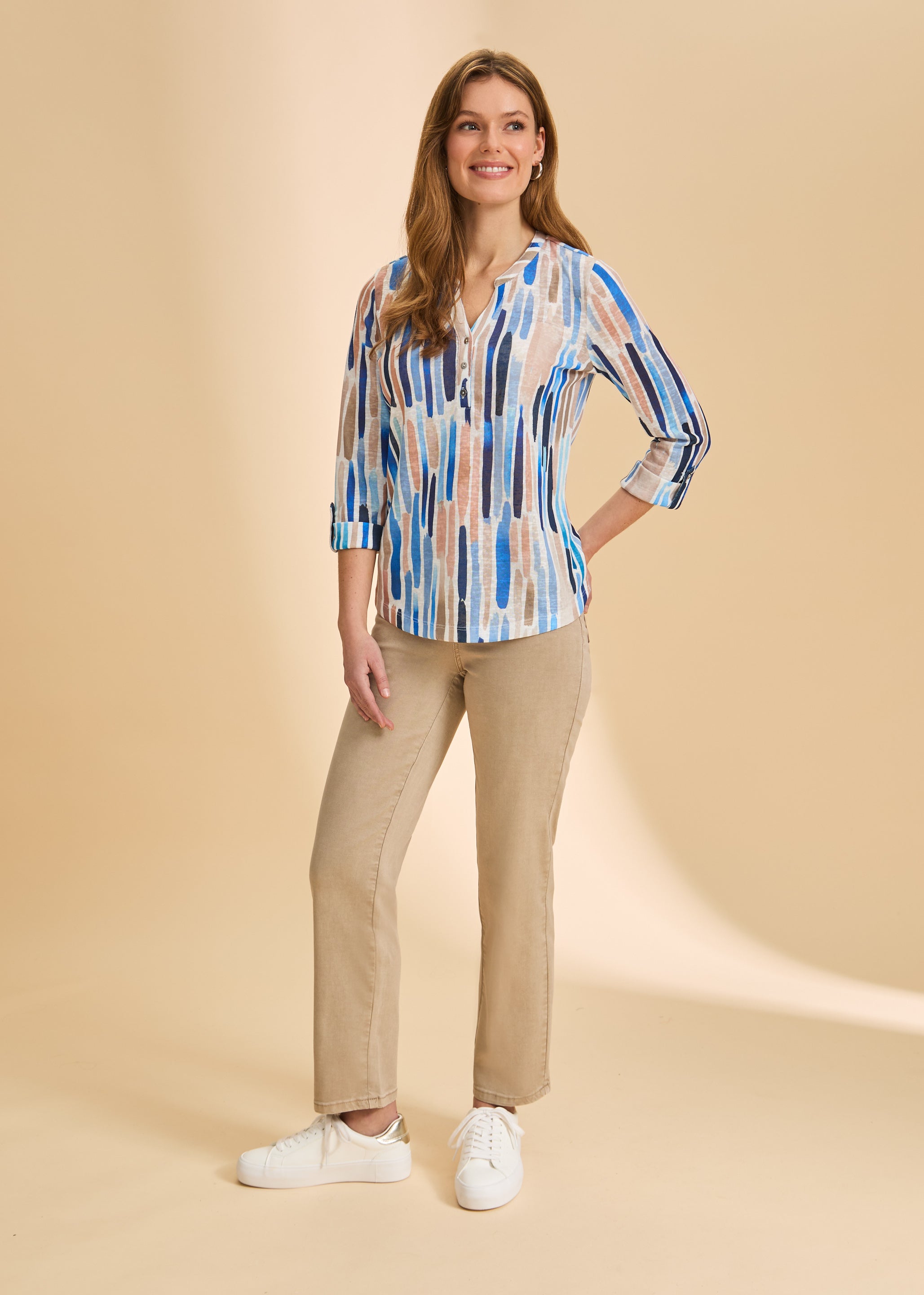 Front view of sand straight-leg jeans, styled with patterned top by French Dressing Jeans (FDJ)