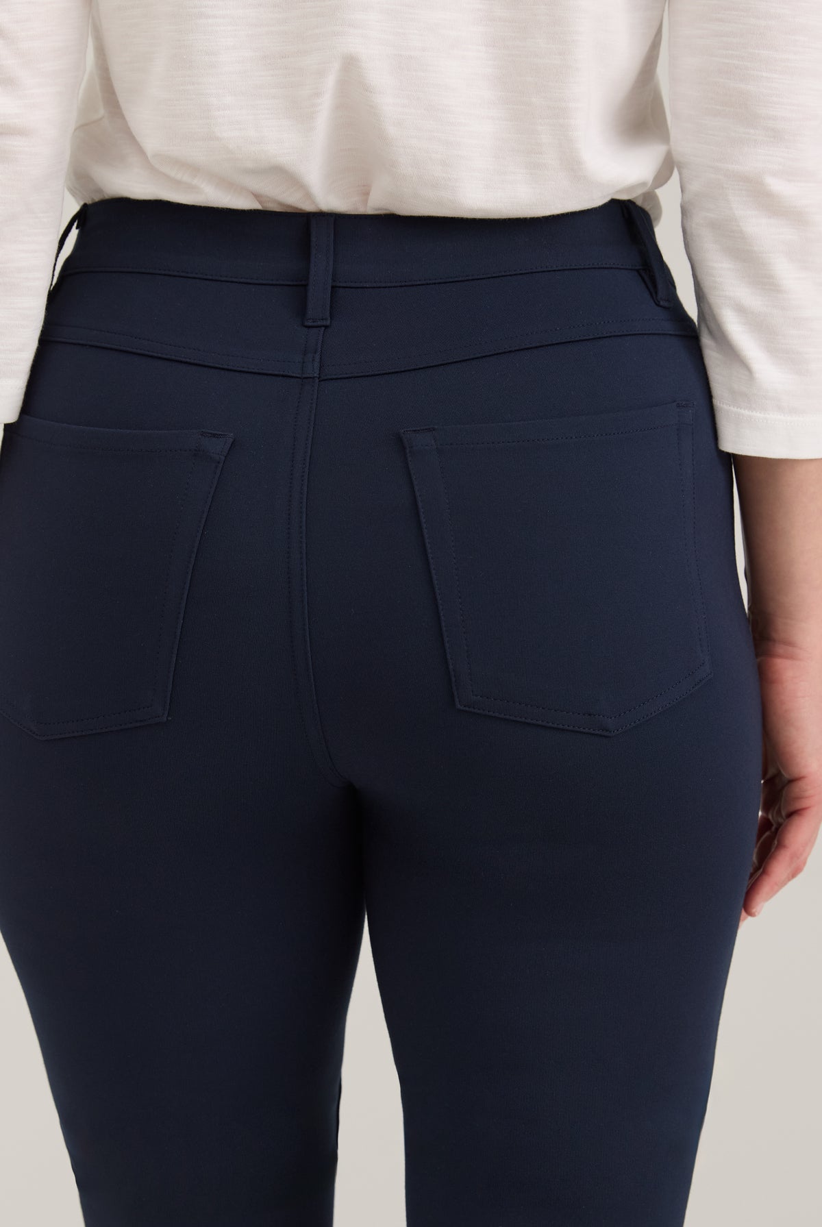 Close-up of navy pants showing back patch pockets and fabric by French Dressing Jeans (FDJ)