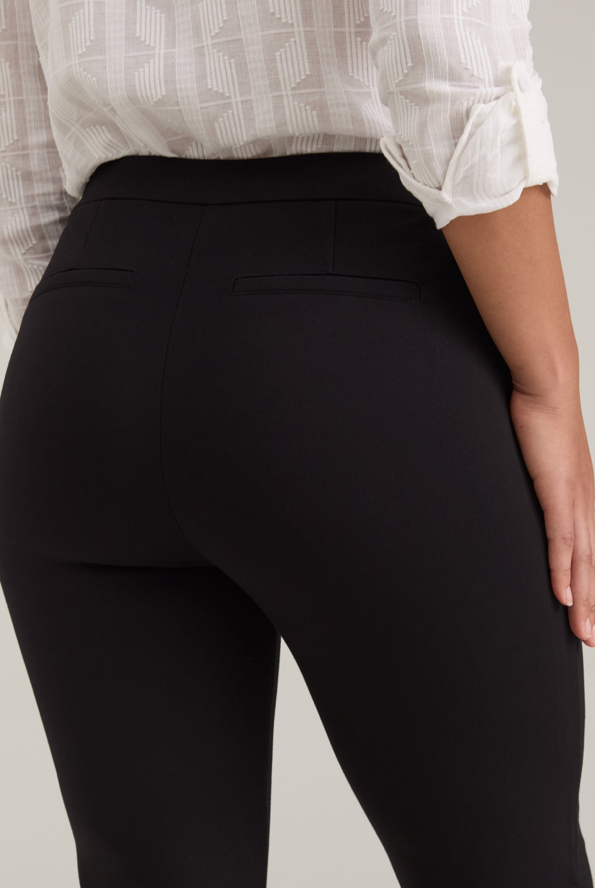 Close-up of fake back welt pockets on black Ponte pants showing fabric texture by French Dressing Jeans (FDJ)