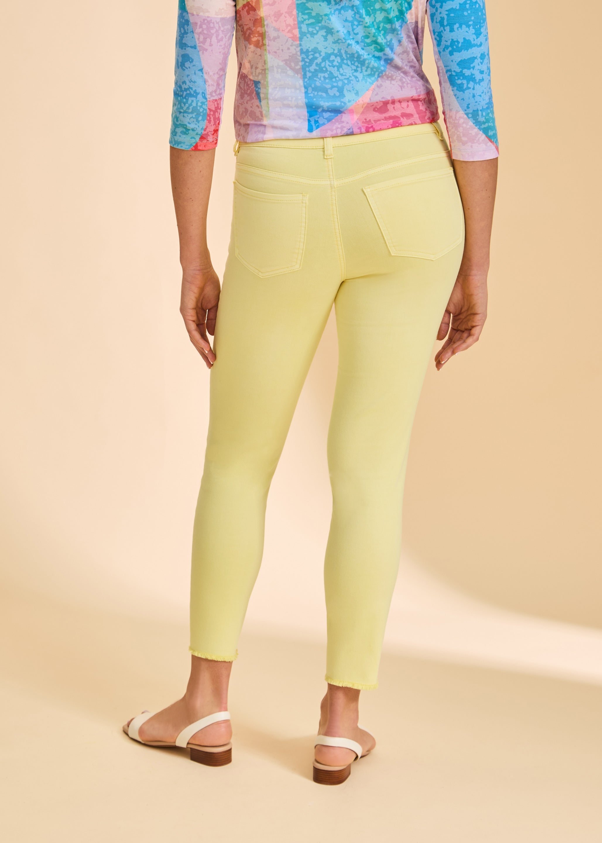 Yellow skinny pants back view showing patch pockets by French Dressing Jeans (FDJ)