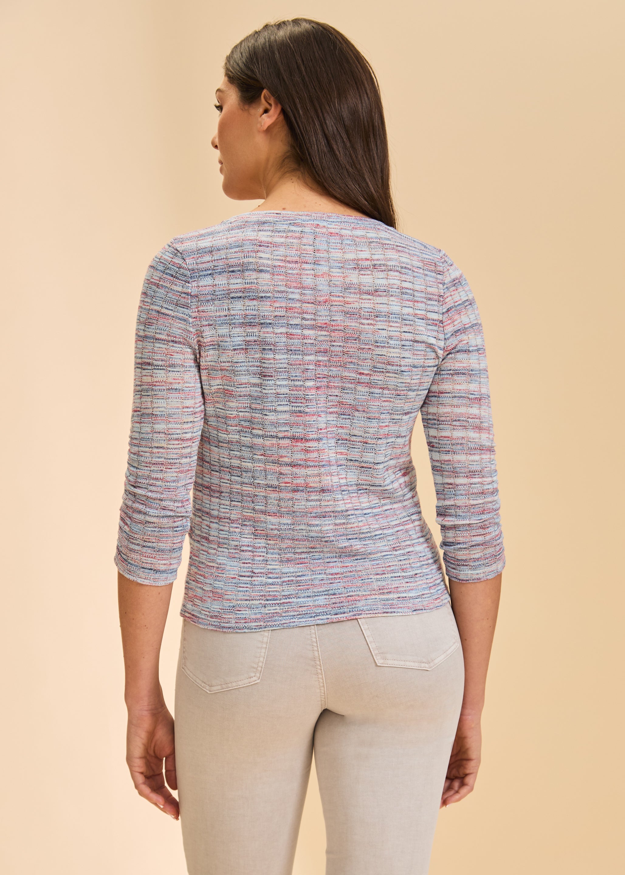 Back view of multicolor V-neck sweater highlighting textured pattern by French Dressing Jeans (FDJ)