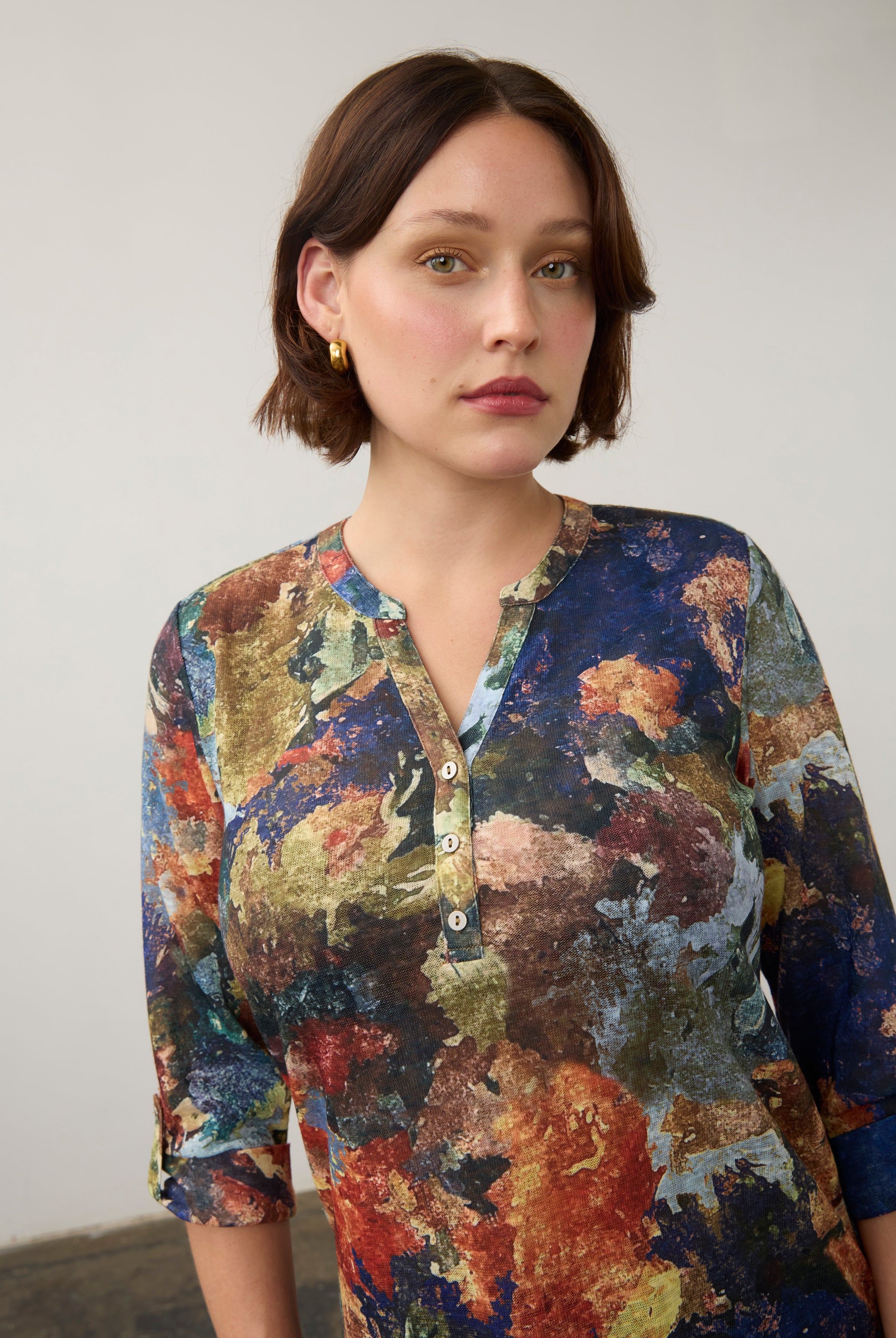 Close-up of multicolor Henley top highlighting button-front and abstract pattern by French Dressing Jeans (FDJ)
