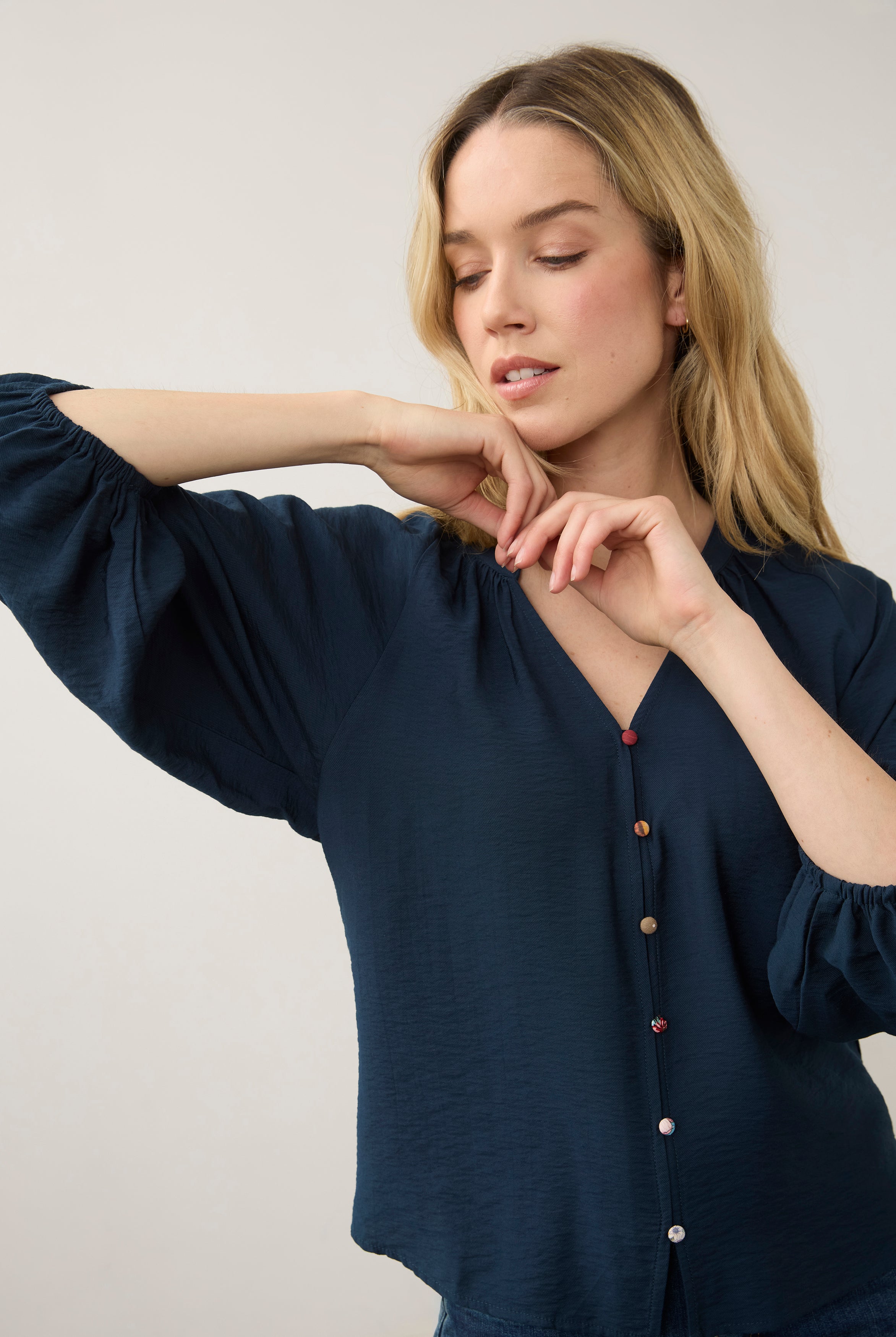 Close-up of navy blouse focusing on colorful buttons by French Dressing Jeans (FDJ)