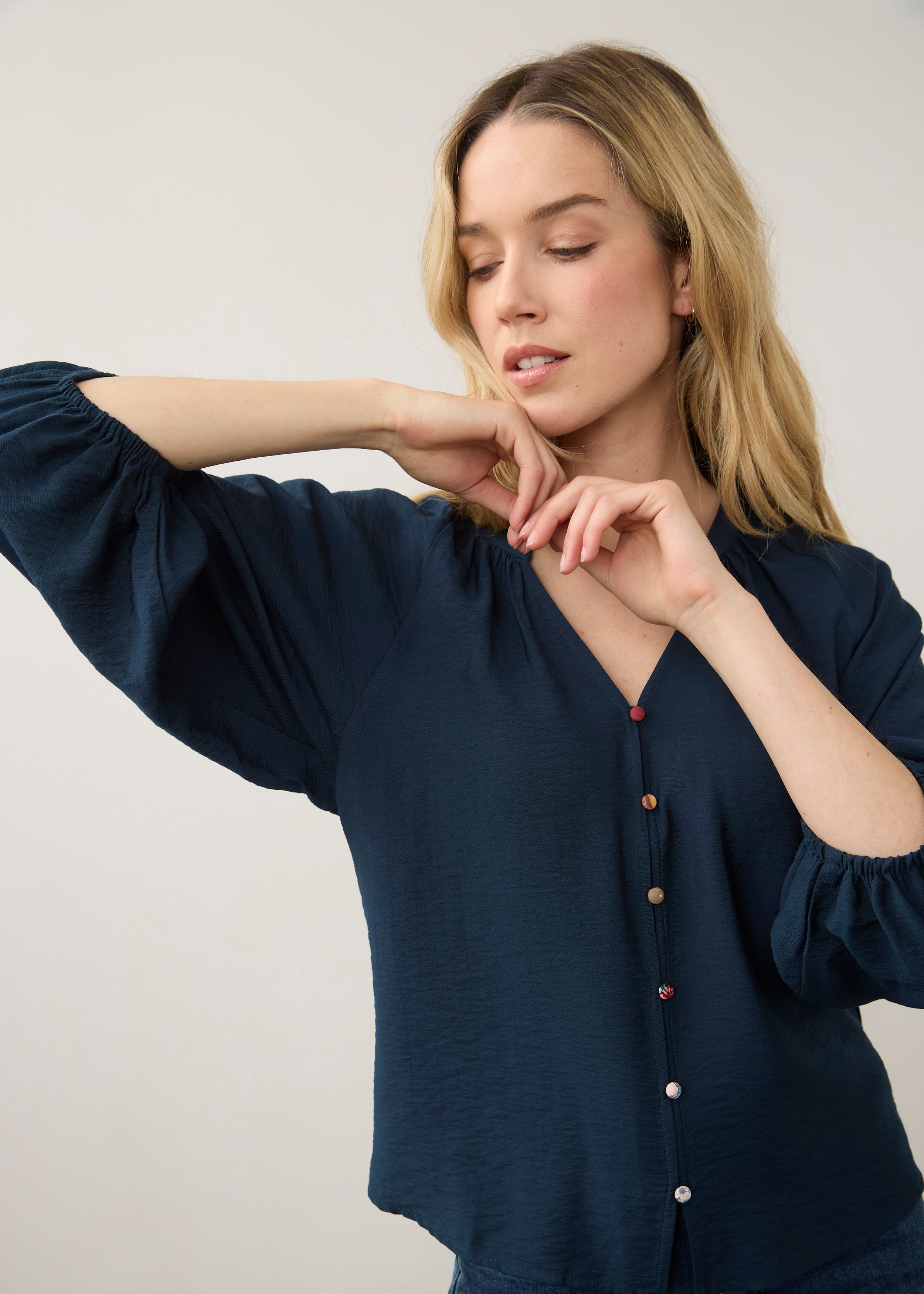 Close-up of navy blouse focusing on colorful buttons by French Dressing Jeans (FDJ)