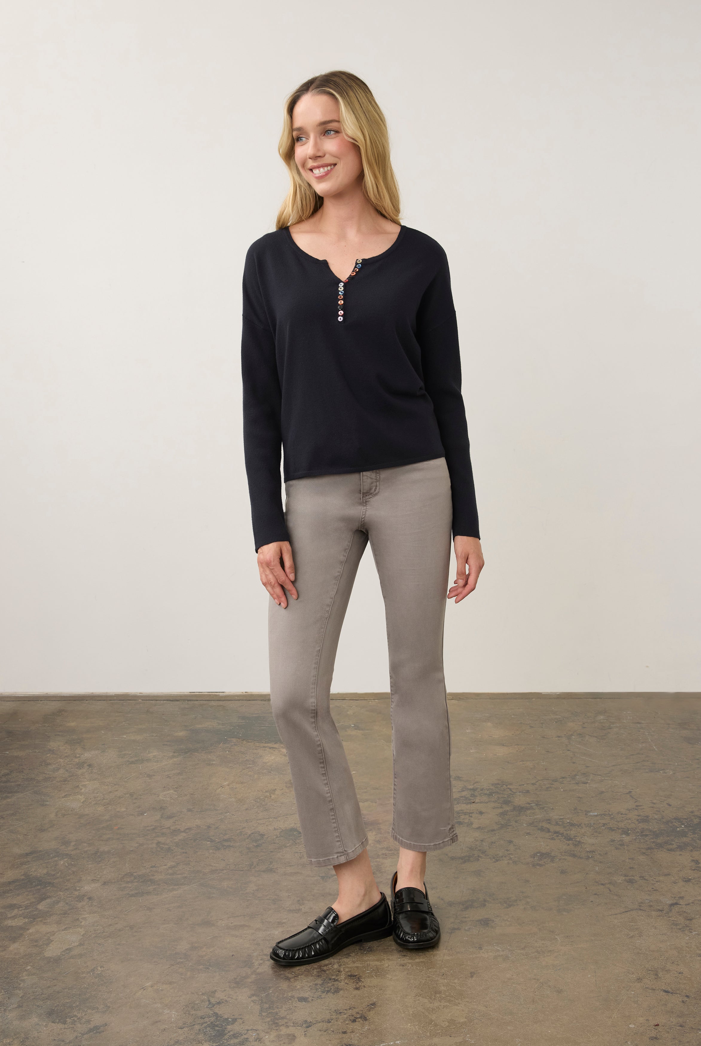 Full view of navy sweater paired with grey jeans by French Dressing Jeans (FDJ)