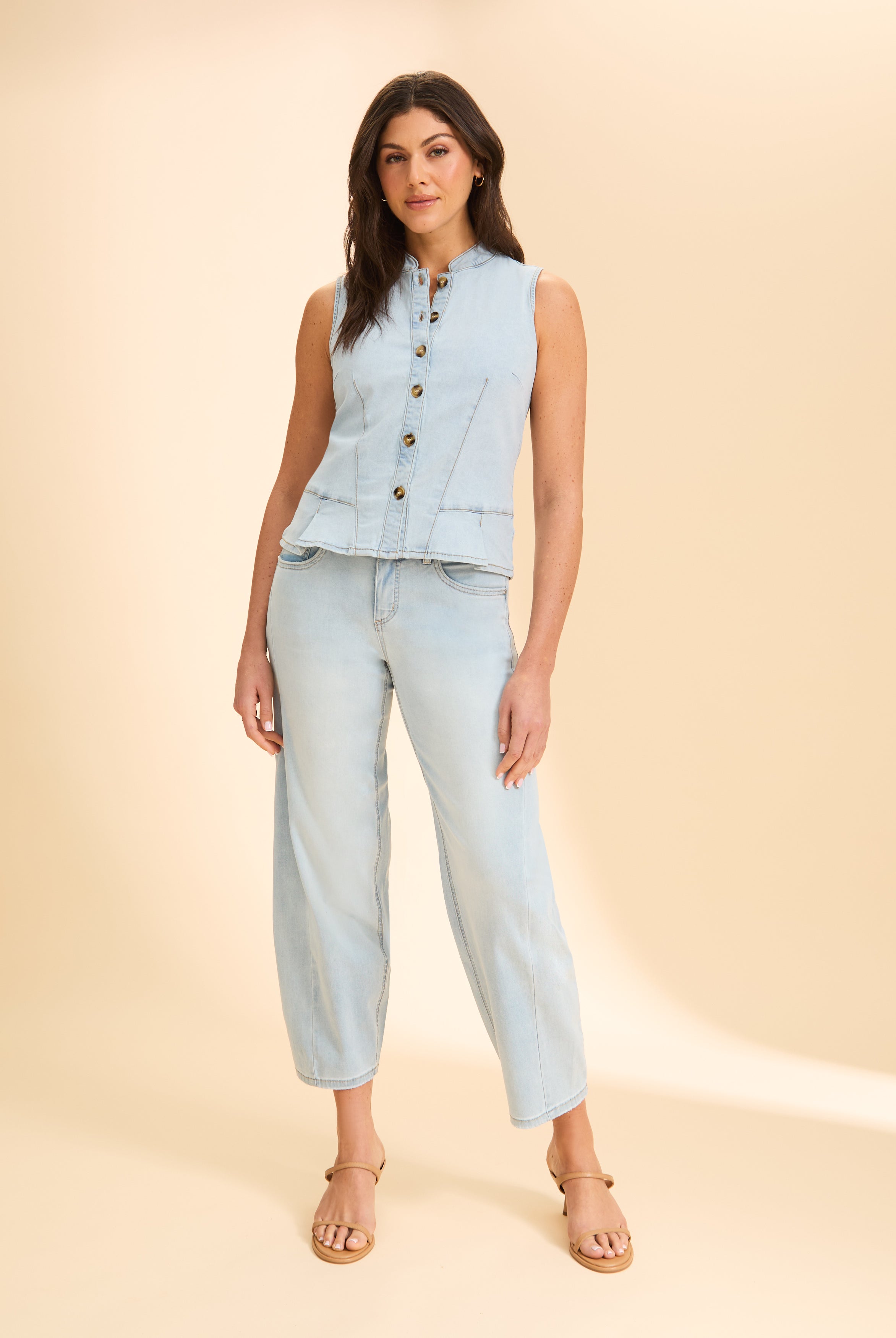 Front view of light wash sleeveless denim top with button closure by French Dressing Jeans (FDJ)