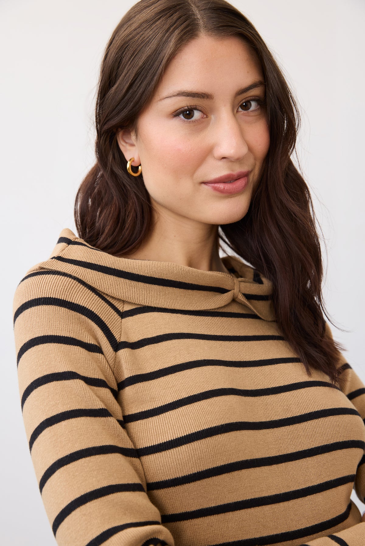 Close-up of striped tan and black sweater highlighting neckline by French Dressing Jeans (FDJ)
