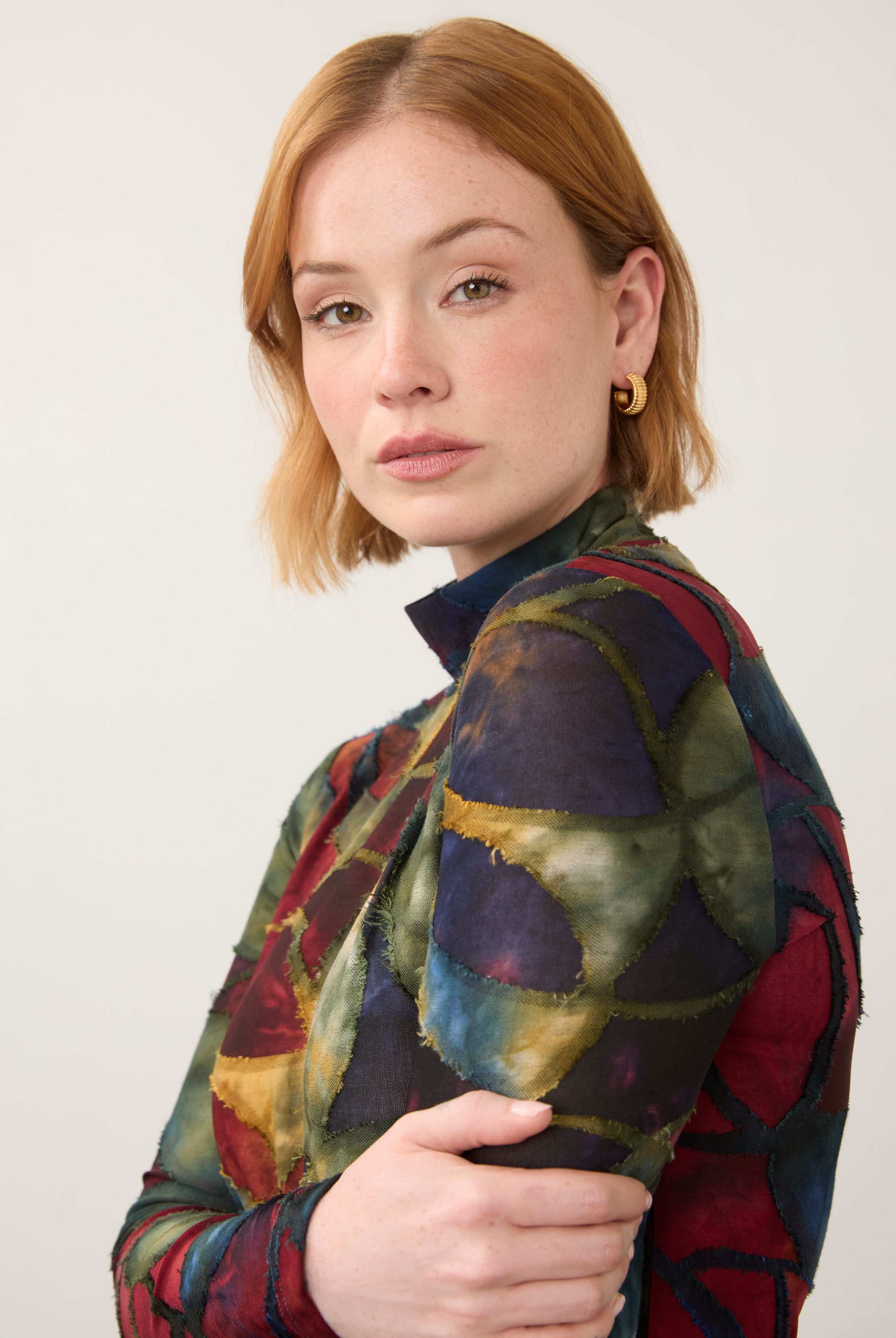 Close-up of abstract print top, showcasing detailed pattern and high neckline by French Dressing Jeans (FDJ)