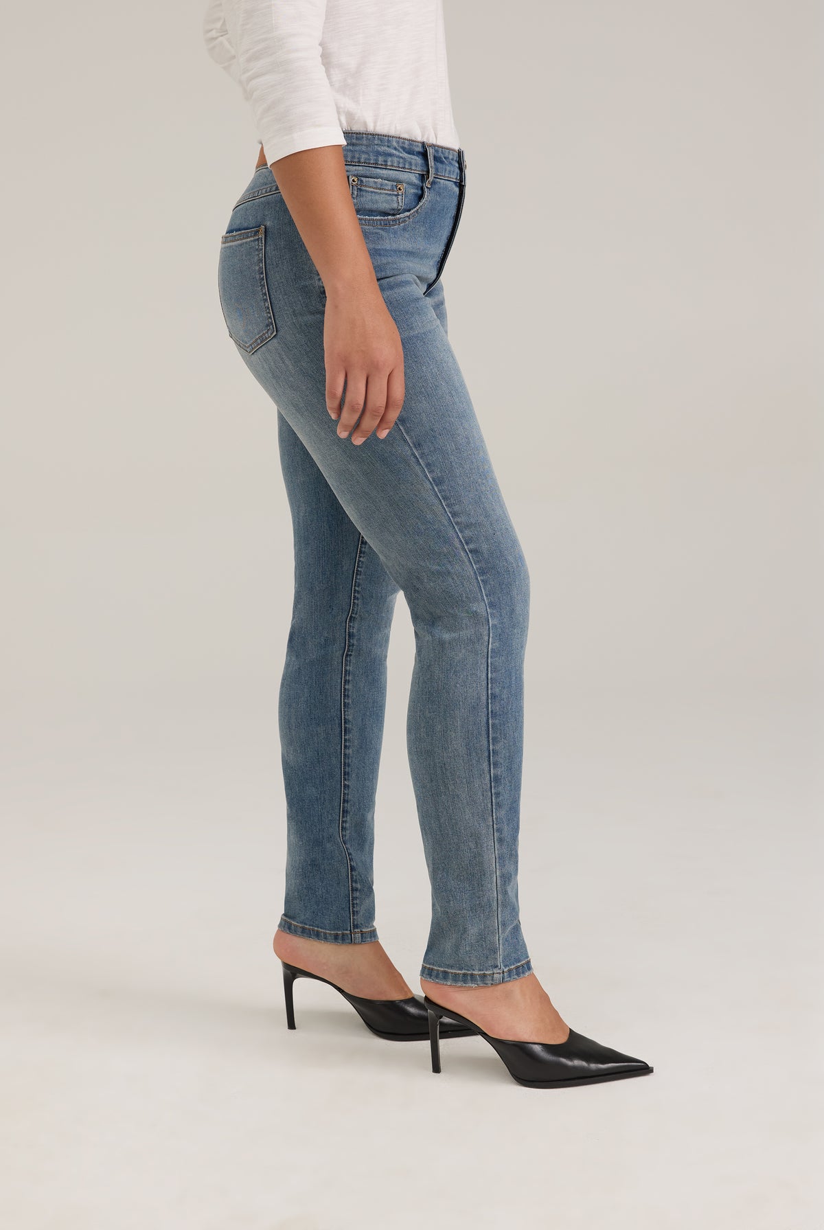 Side profile of light wash slim leg jeans showcasing fit and style by French Dressing Jeans (FDJ)