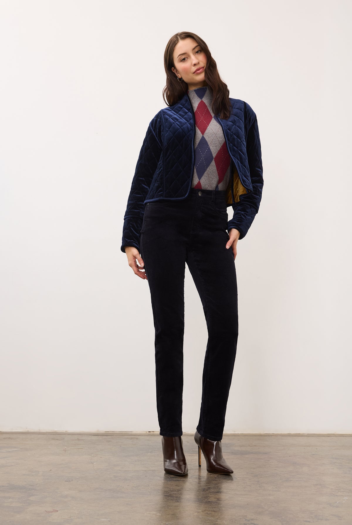 Full-body view of quilted jacket in blueberry, paired with dark pants and boots by French Dressing Jeans (FDJ)