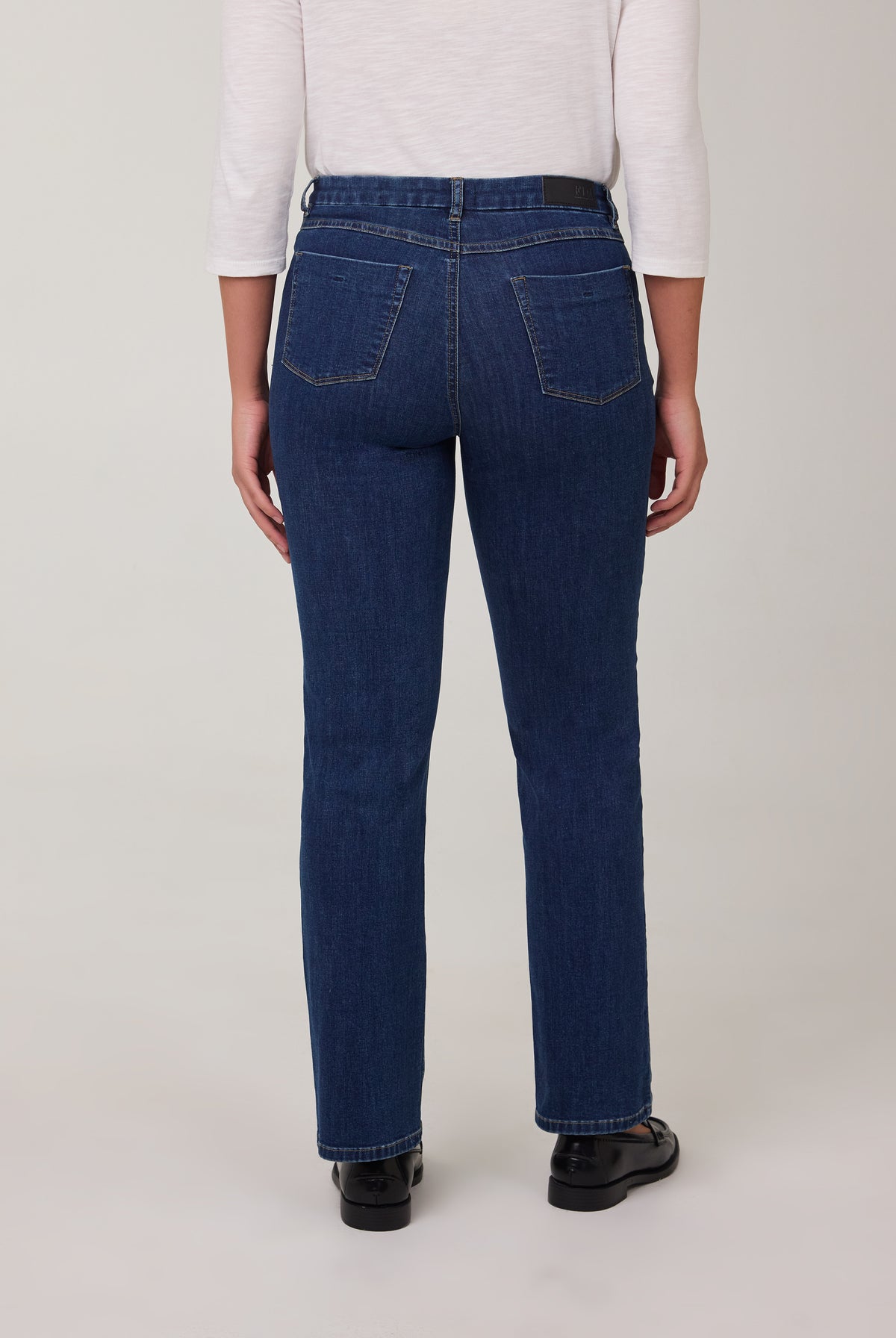 Back view of tapered straight leg jeans in Delight color with patch pockets by French Dressing Jeans (FDJ)