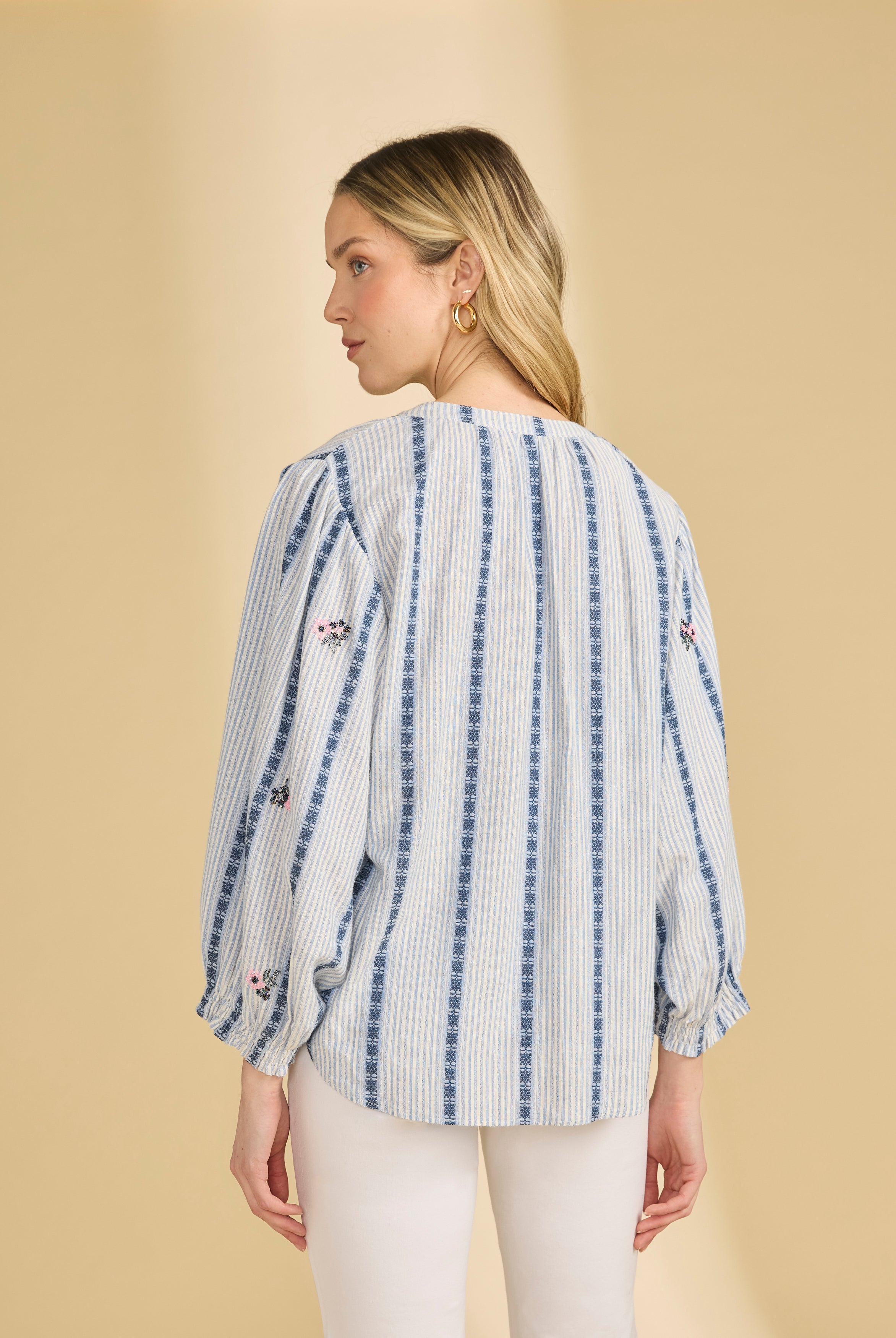 Back view of striped shirt with floral accents and long sleeves indoors by French Dressing Jeans (FDJ)
