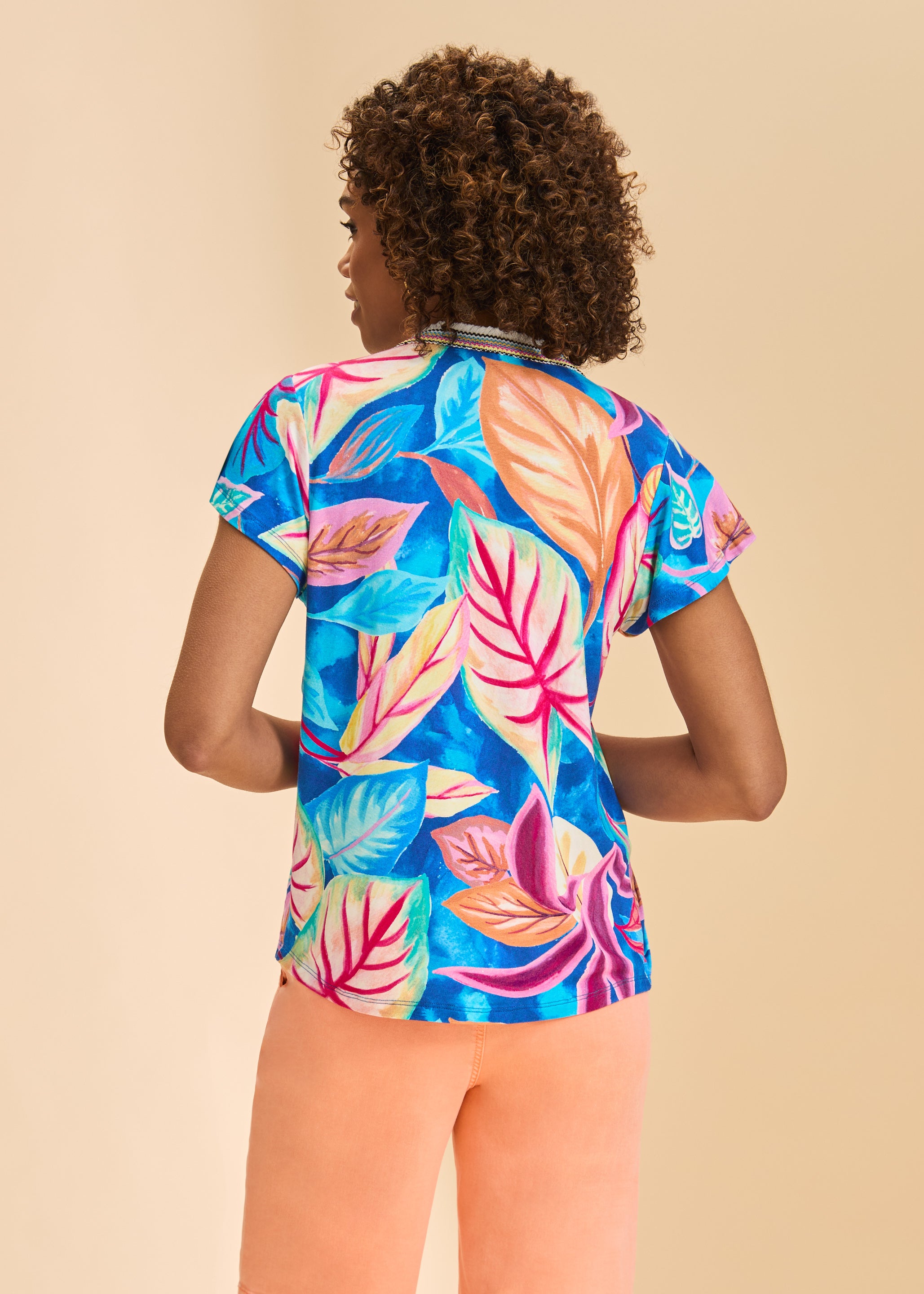Back view of Flutter Sleeve Pintuck Top showcasing vibrant floral pattern by French Dressing Jeans (FDJ)