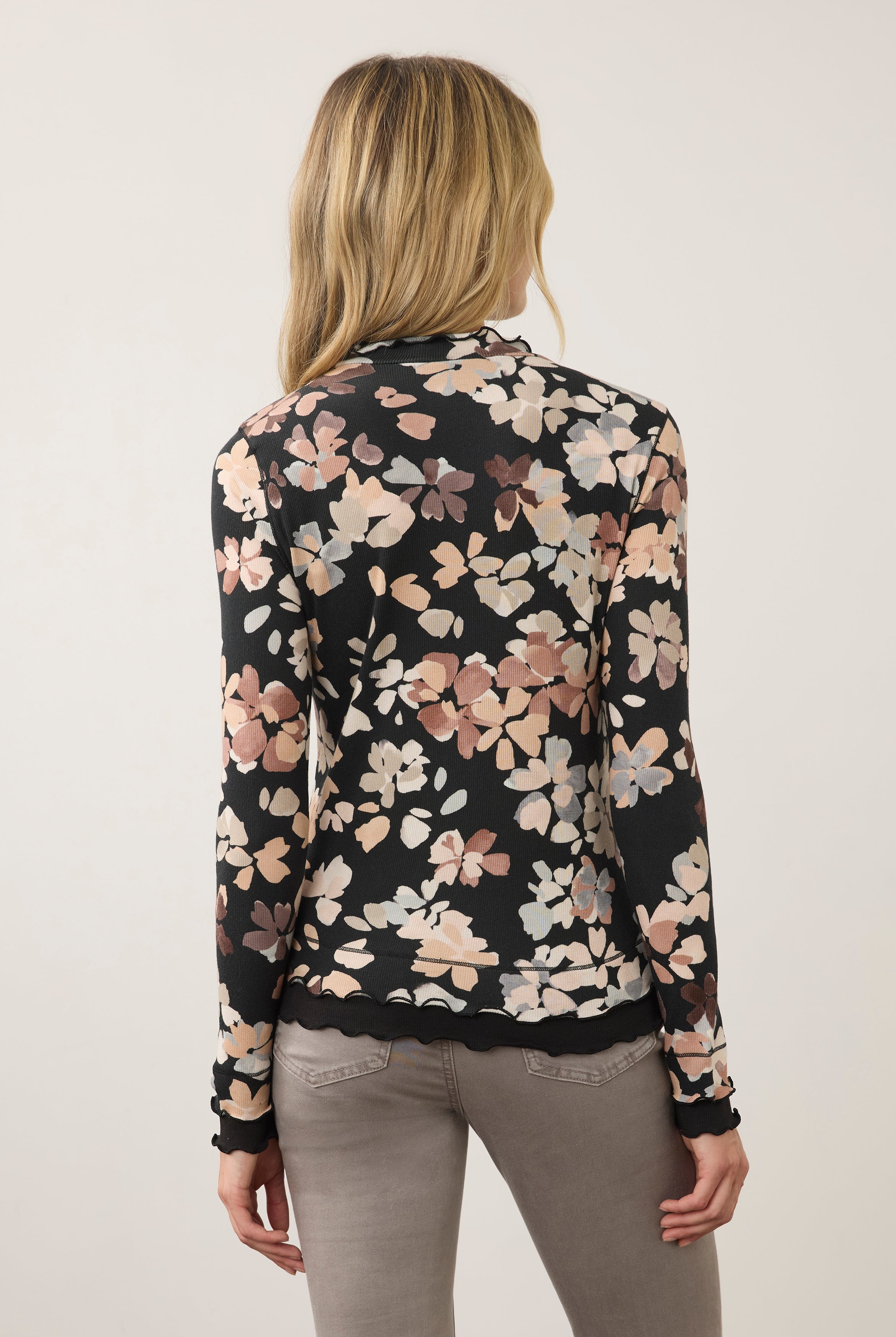 Back view of floral black top, highlighting seamless design and scalloped edges by French Dressing Jeans (FDJ)