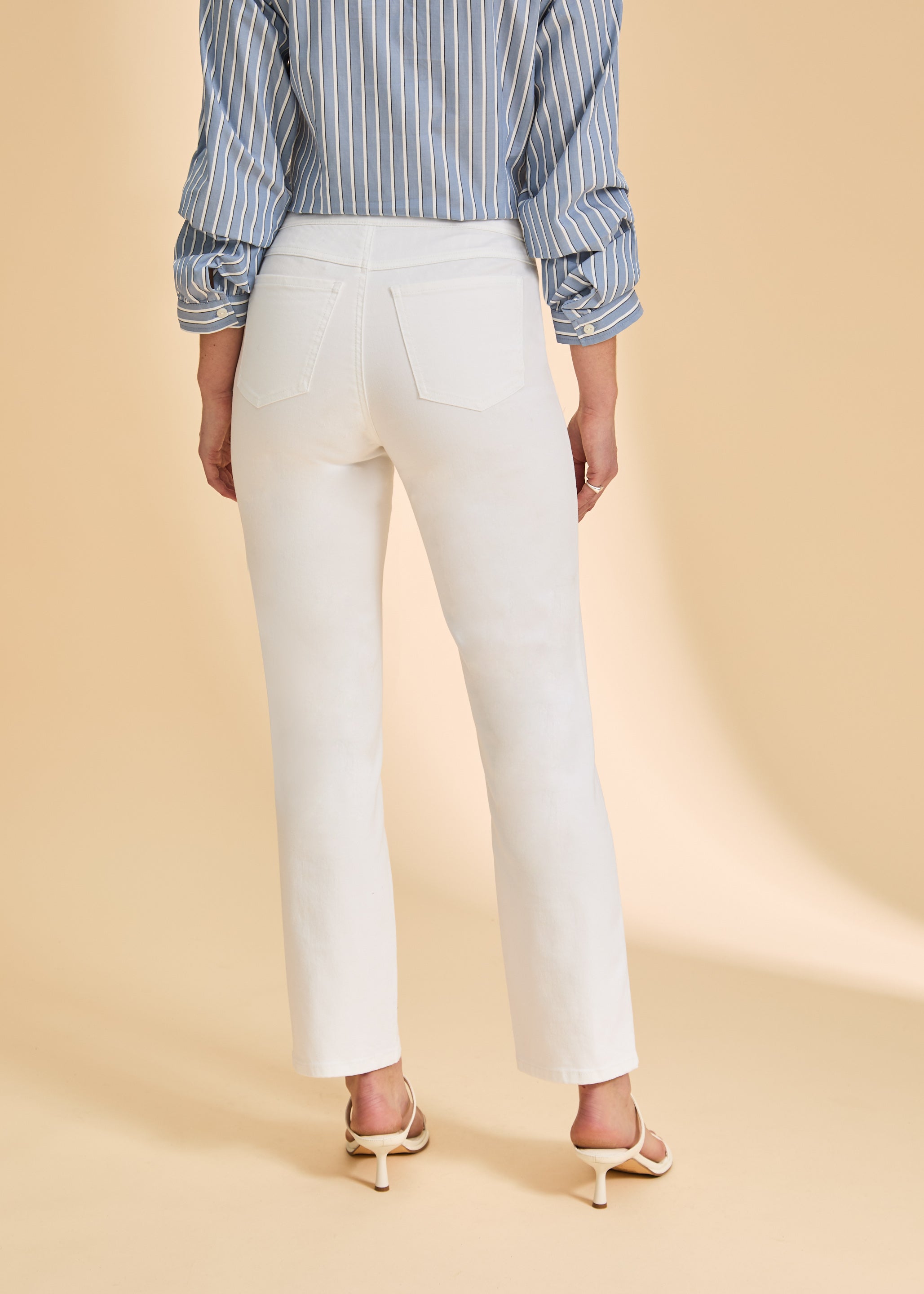 Back view of white straight-leg jeans, showcasing tailored pockets by French Dressing Jeans (FDJ)