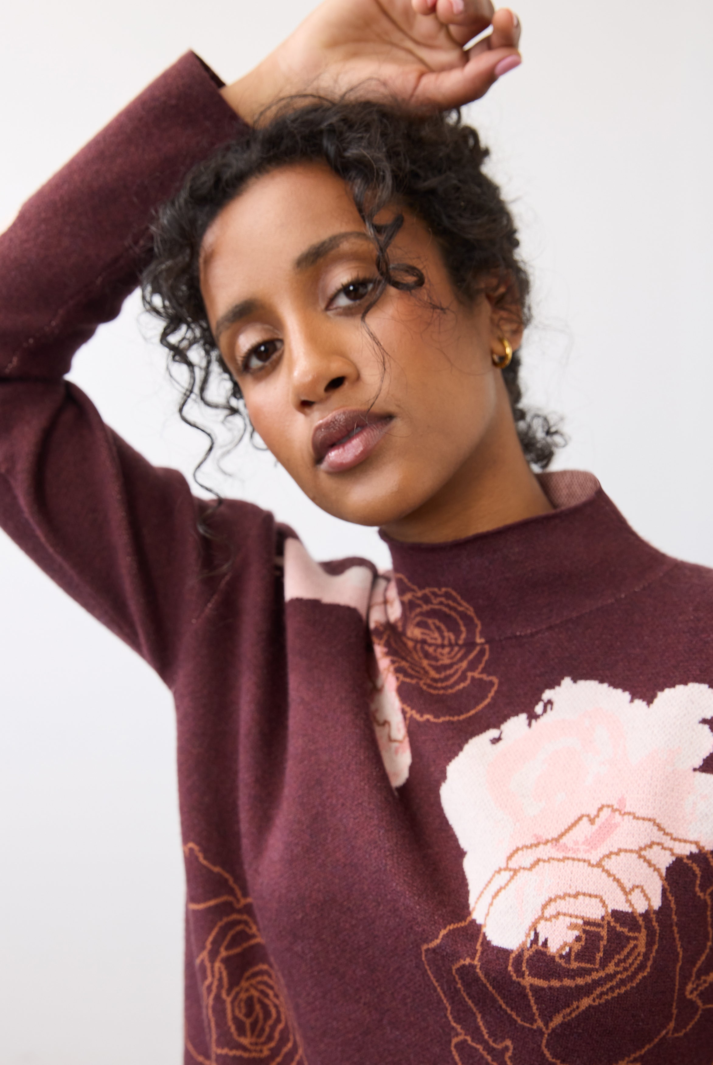 Close-up of burgundy floral sweater showing rose design and collar detail by French Dressing Jeans (FDJ)