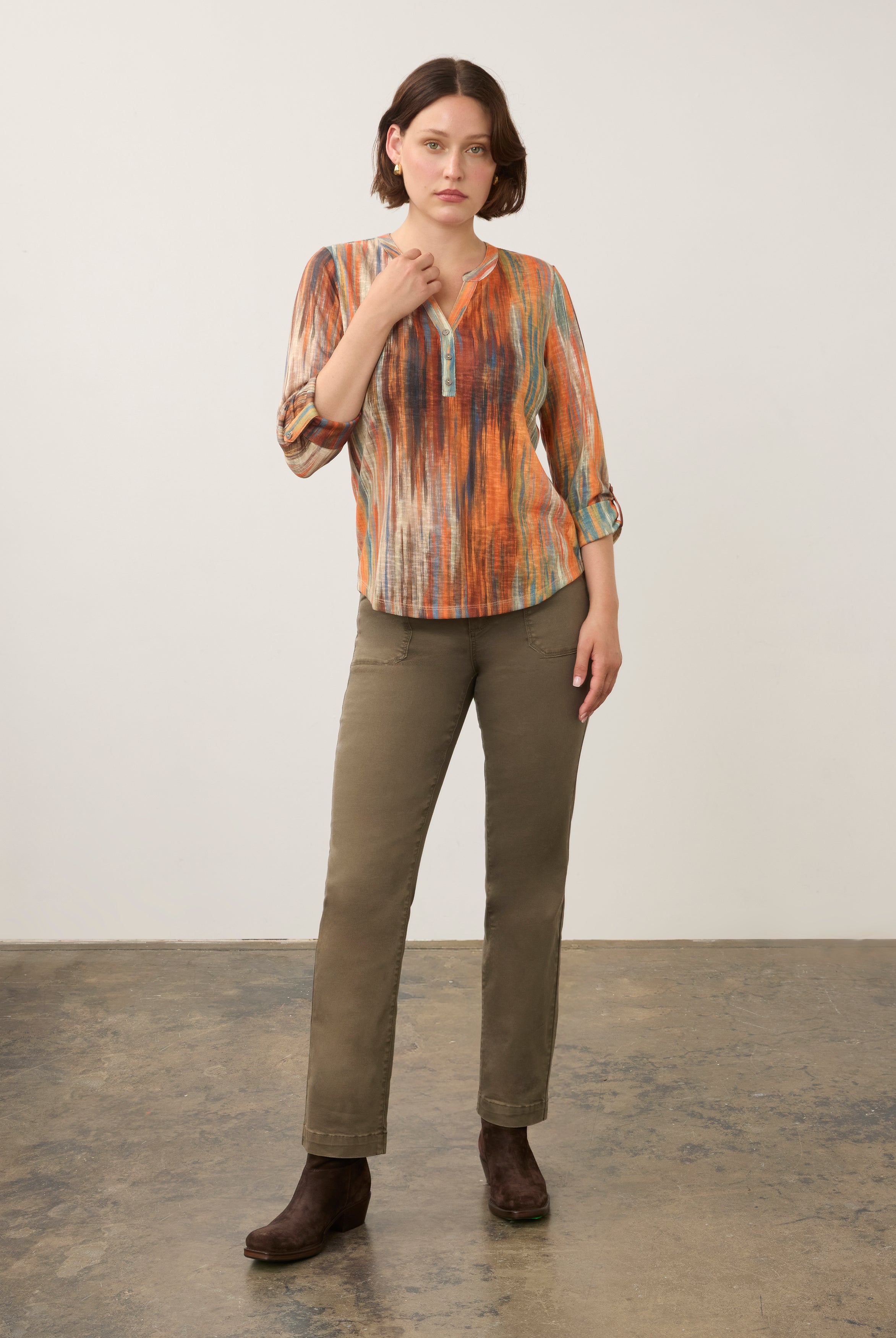 Full body view of Heat Henley top styled with olive pants and brown boots by French Dressing Jeans (FDJ)