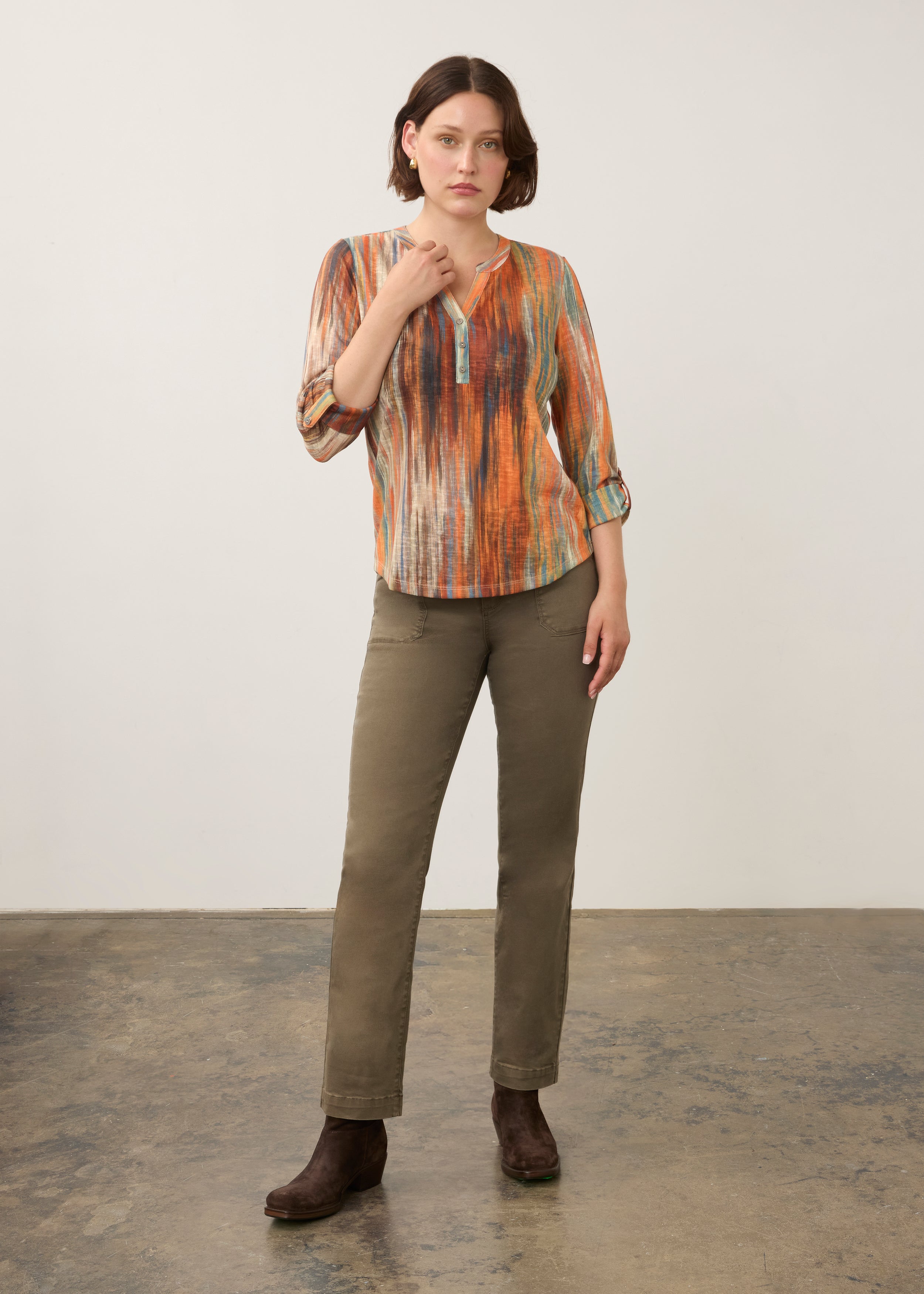 Full body view of Heat Henley top styled with olive pants and brown boots by French Dressing Jeans (FDJ)