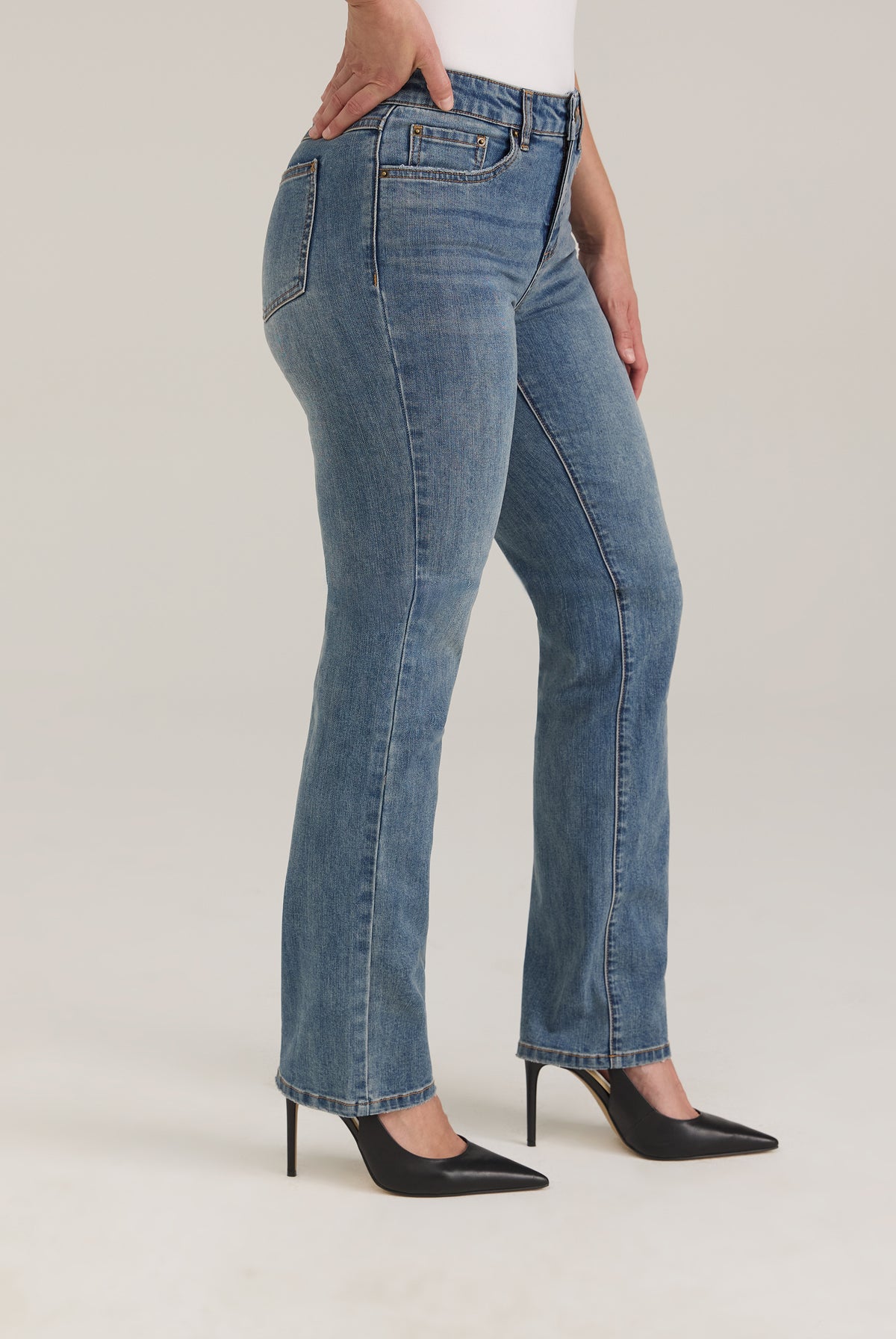 Side profile of Olivia straight leg denim in light wash highlighting slim fit and mid-rise waist by French Dressing Jeans (FDJ)