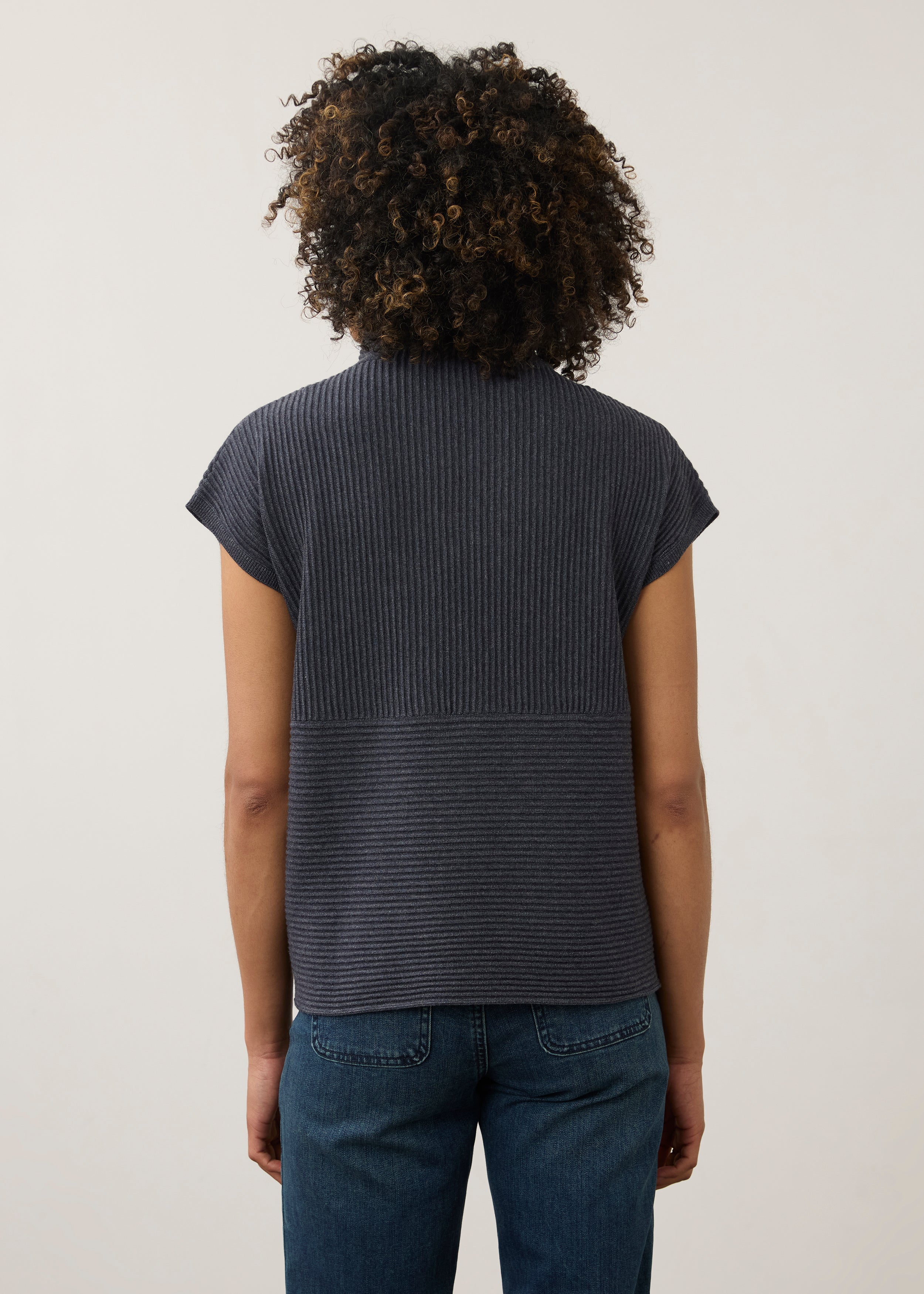 Back view of navy ribbed top with high collar and seamless design by French Dressing Jeans (FDJ)