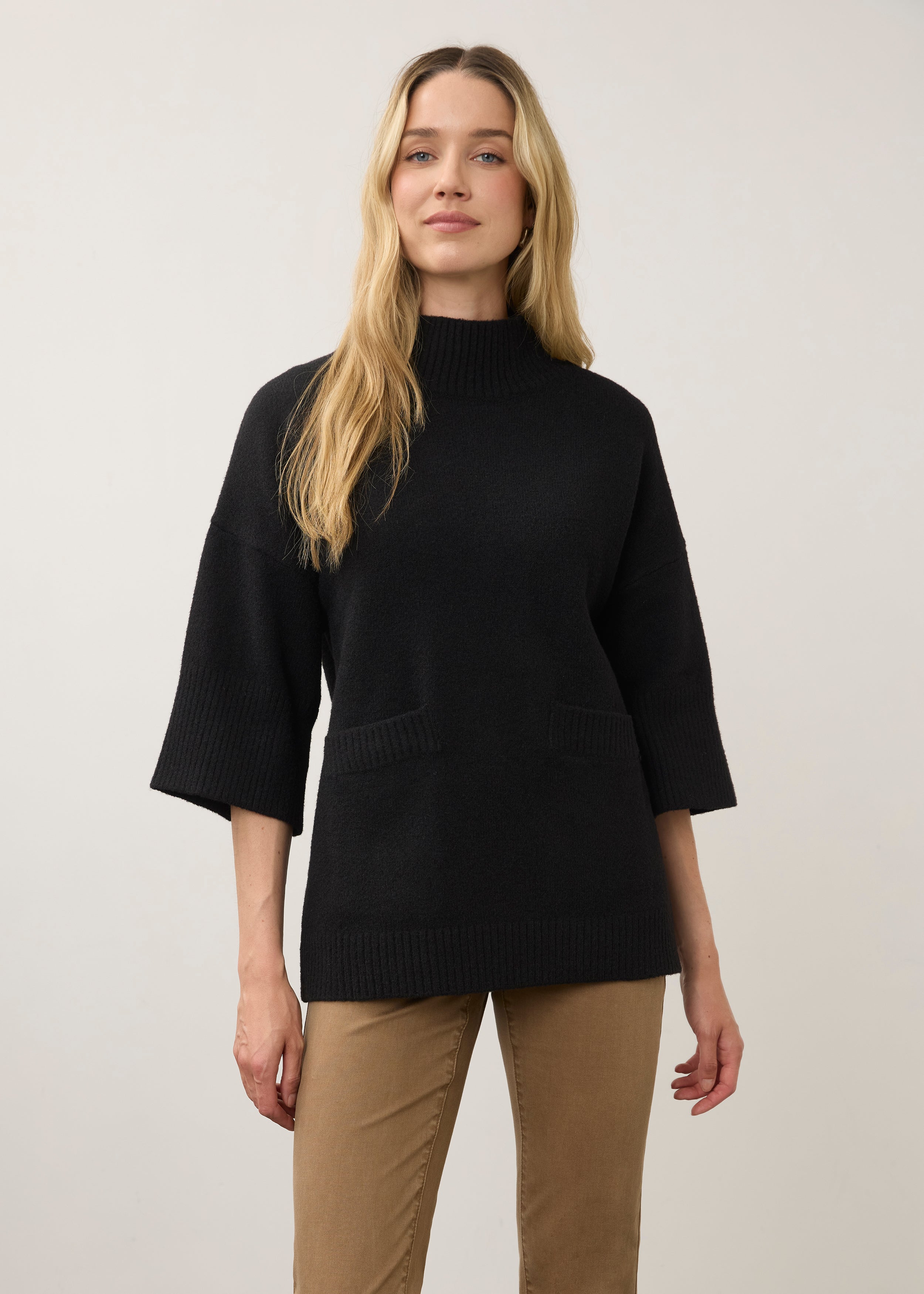 Front view of black tunic sweater with wide sleeves and front pockets by French Dressing Jeans (FDJ)