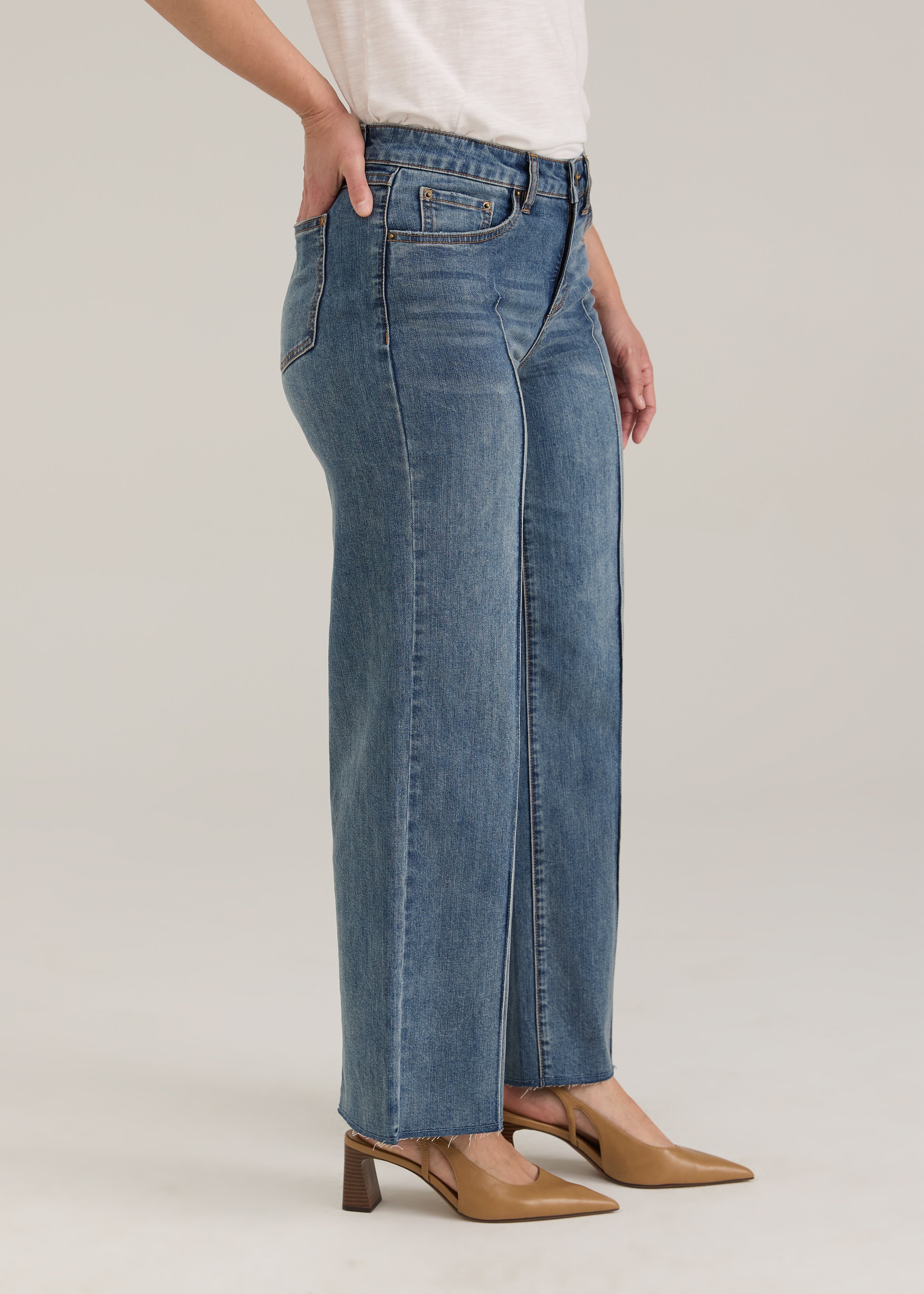 Side profile of Olivia denim in light wash highlighting wide ankle and mid-rise waist by French Dressing Jeans (FDJ)