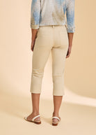 Back view of cream crop pants with patch pockets and slim silhouette by French Dressing Jeans (FDJ)
