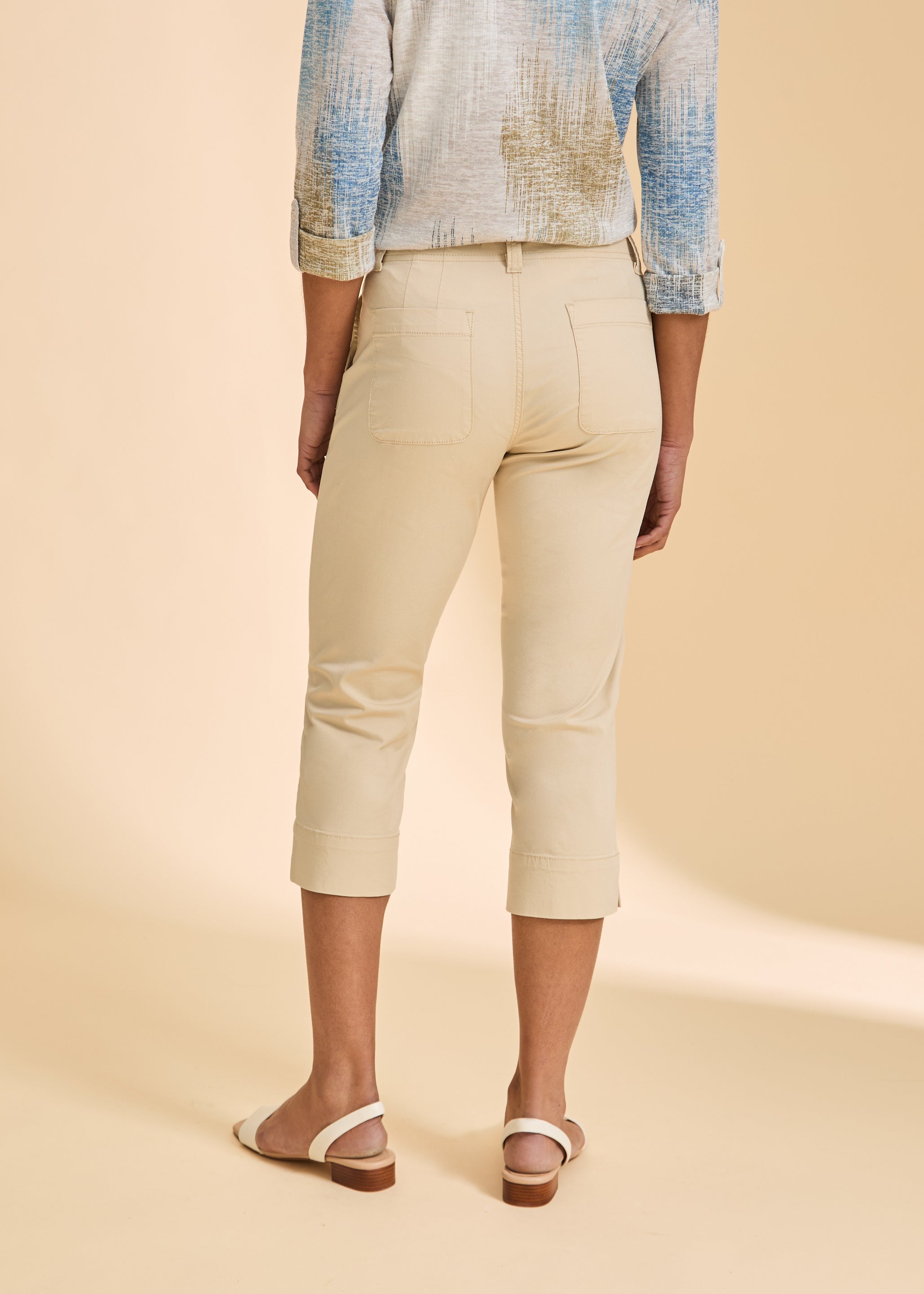 Back view of cream crop pants with patch pockets and slim silhouette by French Dressing Jeans (FDJ)