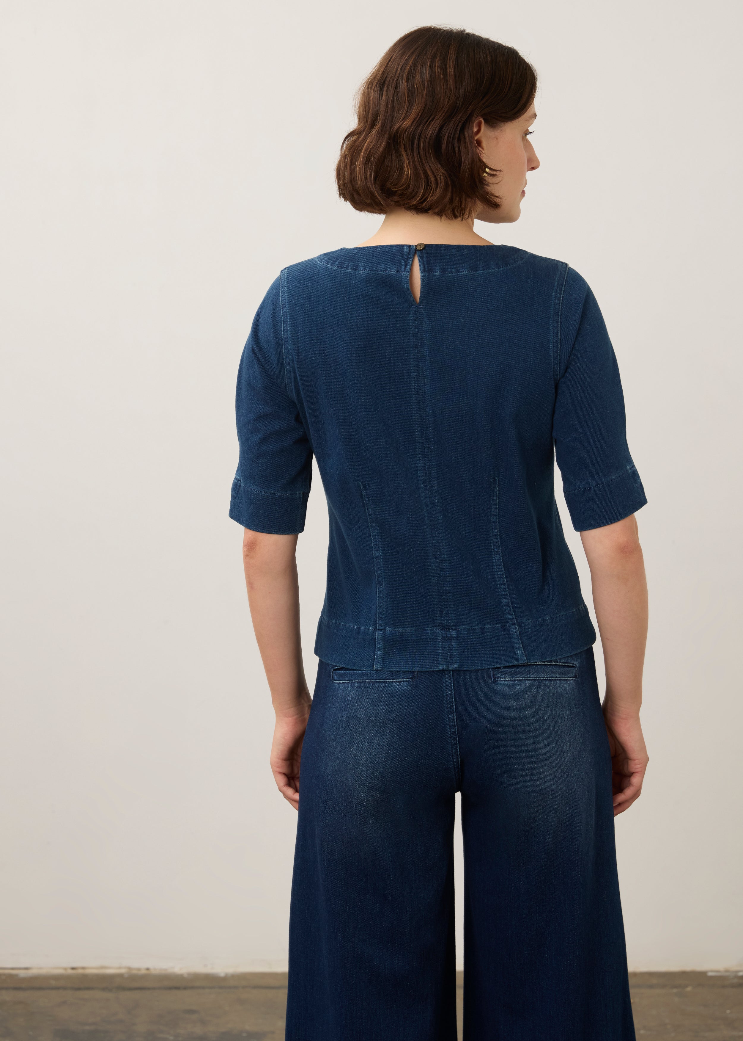Back view of dark rinse fitted top featuring keyhole and seam detailing by French Dressing Jeans (FDJ)