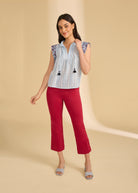 Full outfit view with flutter sleeve top in Spritz Stripes and red pants accentuating style by French Dressing Jeans (FDJ)