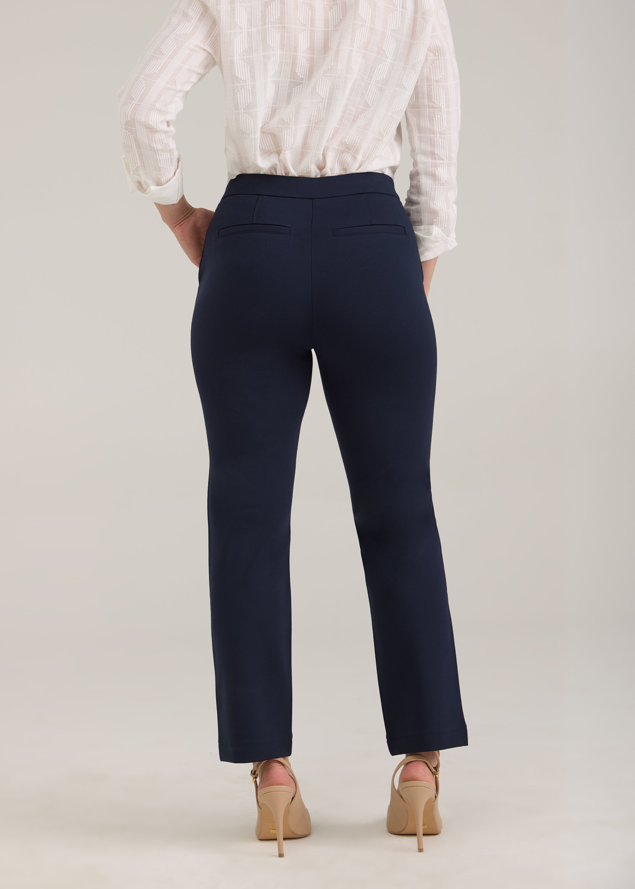 Back view of navy ankle pants featuring fake back welt pockets by French Dressing Jeans (FDJ)