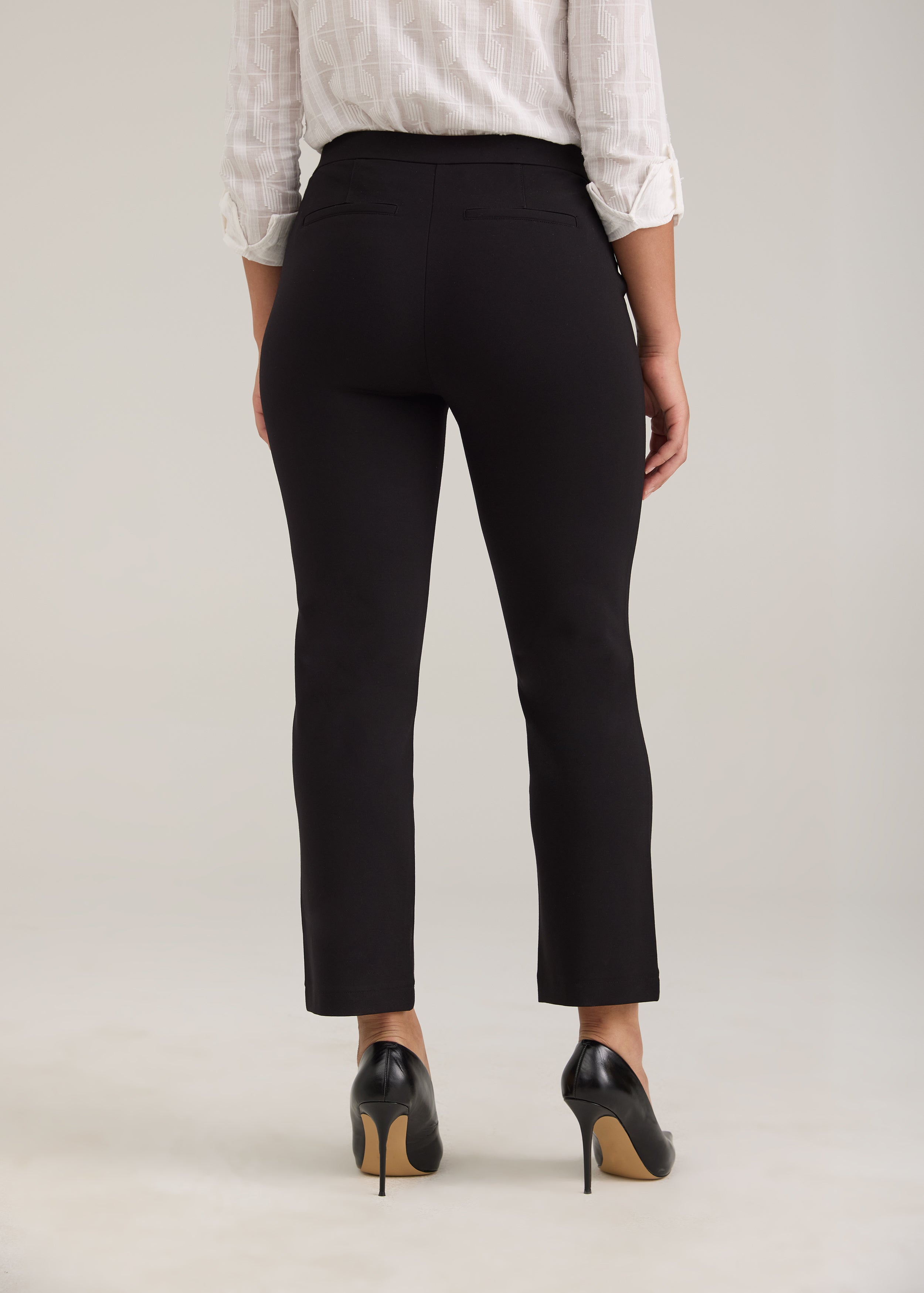 Back view of black ankle pants featuring fake back welt pockets by French Dressing Jeans (FDJ)