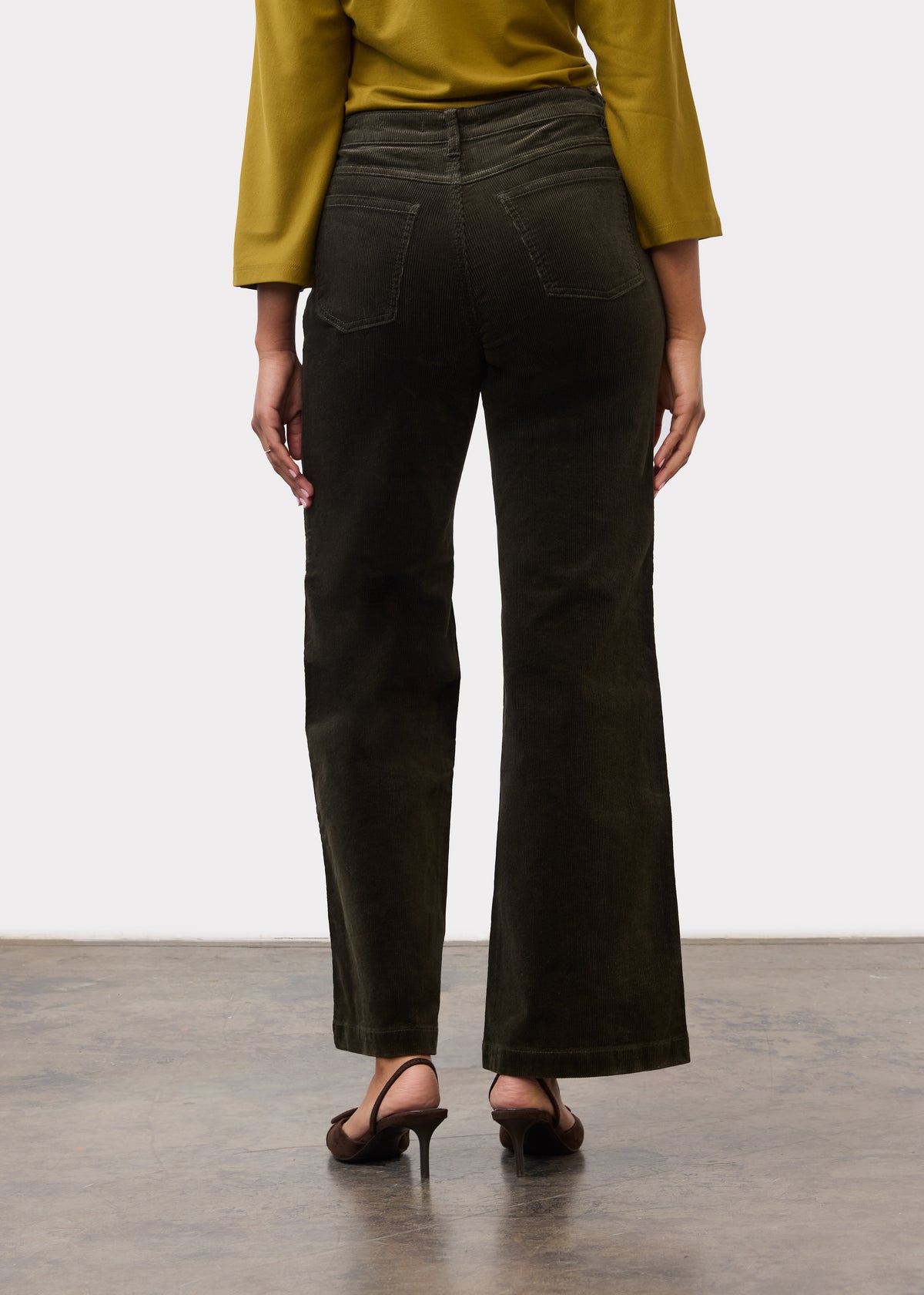 Back view of olive wide leg pants featuring back patch pockets and tailored fit by French Dressing Jeans (FDJ)