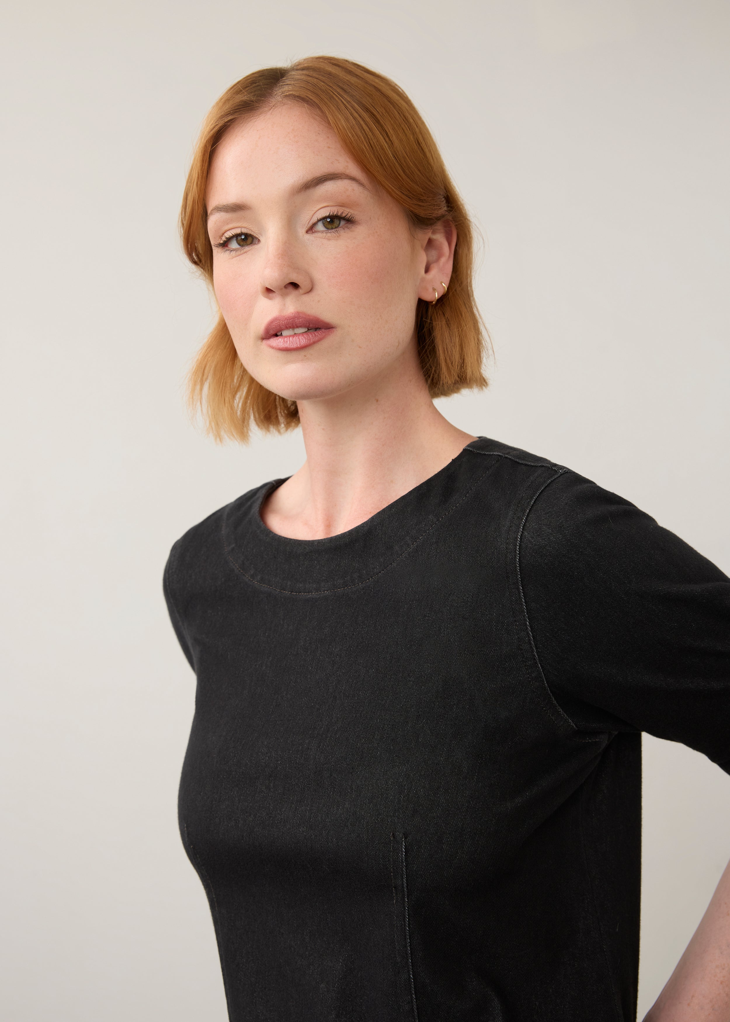 Close-up of black fitted top with focus on neckline and fabric texture by French Dressing Jeans (FDJ)
