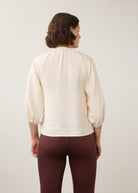 Back view of cream blouse highlighting puff sleeves by French Dressing Jeans (FDJ)