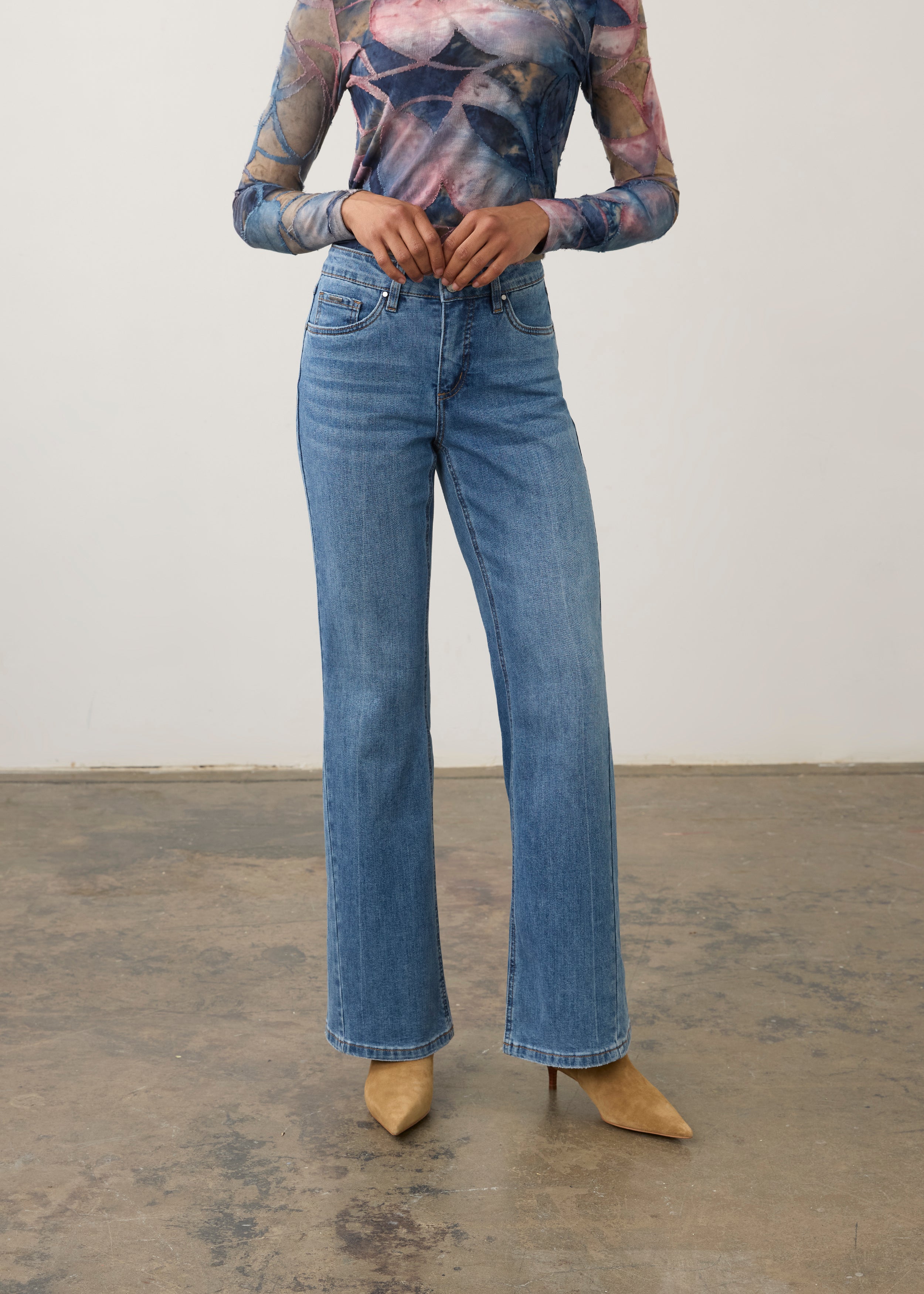 Front view of medium wash denim pants showing high-rise waist and bootcut style by French Dressing Jeans (FDJ) par French Dressing Jeans (FDJ)