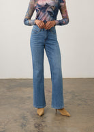 Front view of medium wash denim pants showing high-rise waist and bootcut style by French Dressing Jeans (FDJ) par French Dressing Jeans (FDJ)