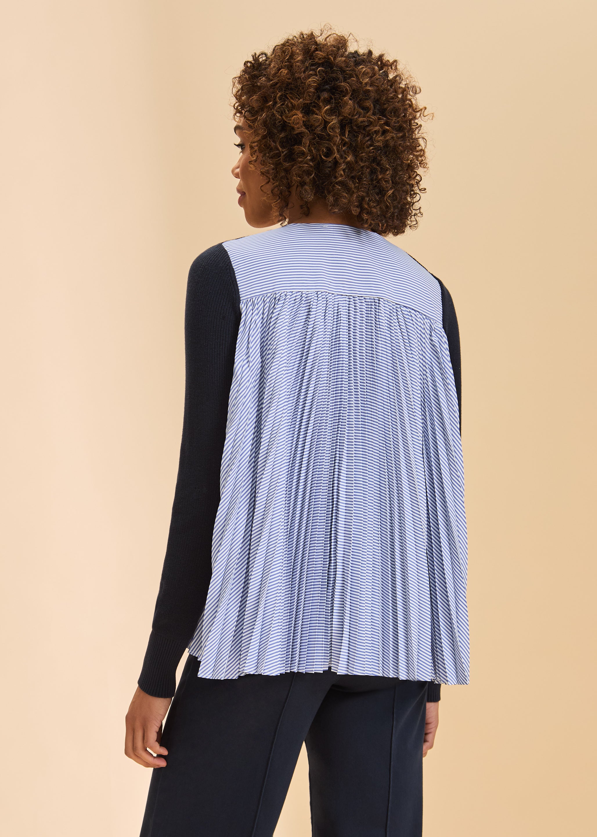 Back view of navy cardigan highlighting striped pleated fabric detail by French Dressing Jeans (FDJ)