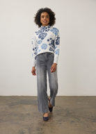 Model in blue floral sweater with grey jeans, full outfit view by French Dressing Jeans (FDJ)