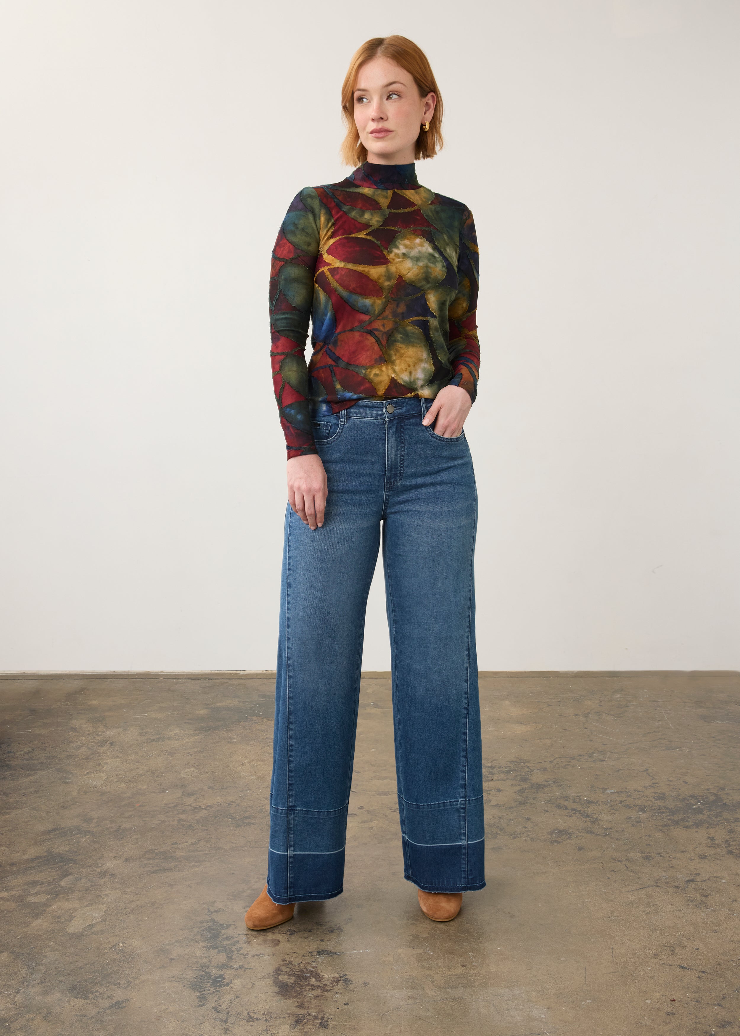 Full body view of wide-leg dark wash jeans with artistic top, showcasing relaxed fit by French Dressing Jeans (FDJ) par French Dressing Jeans (FDJ)